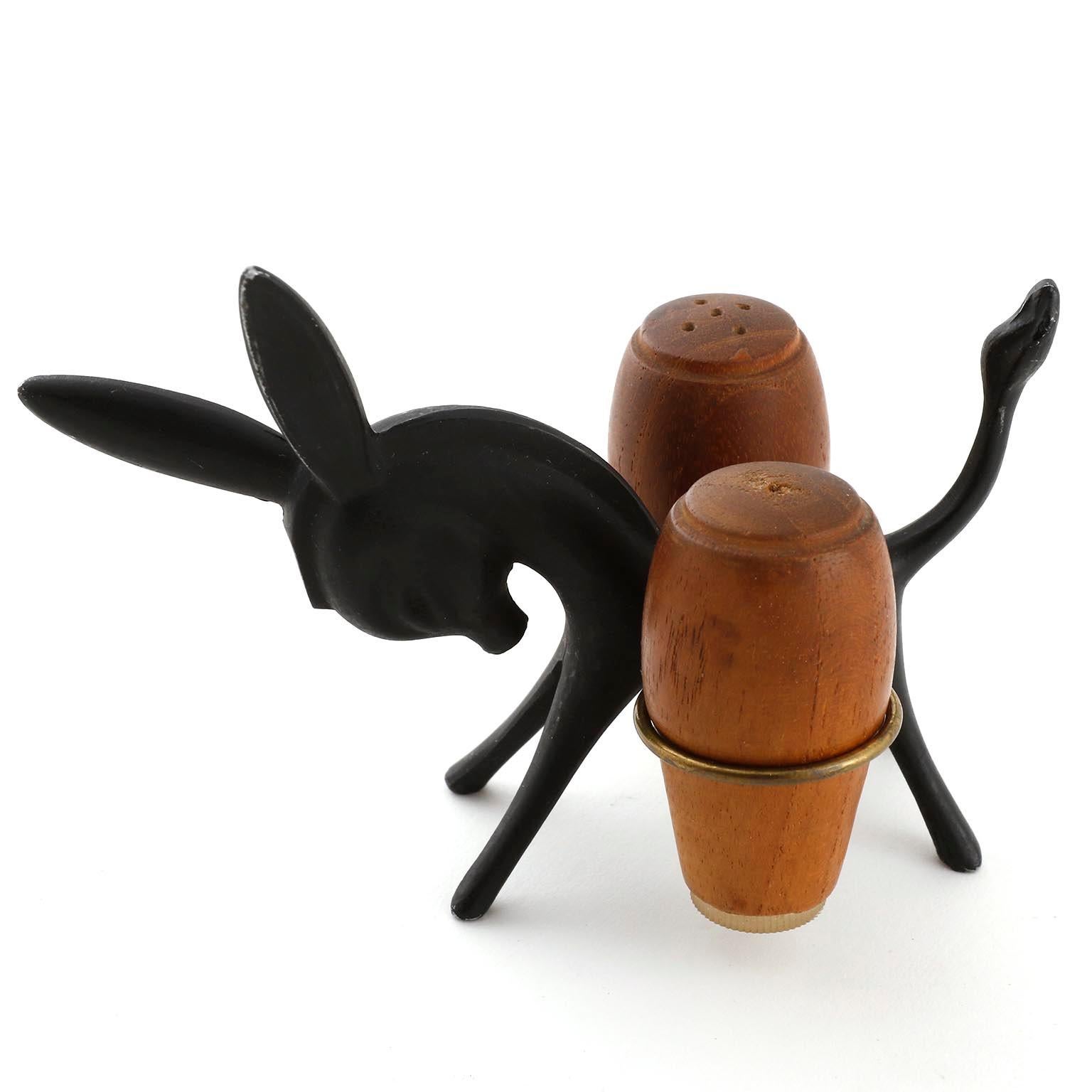 A salt and pepper shaker donkey set designed by Walter Bosse and manufactured by Hertha Baller, Austria, Vienna, in midcentury in 1950s.
The donkey is made of blackened brass. The shakers are made of teak wood.
This charming piece is an eyecatcher