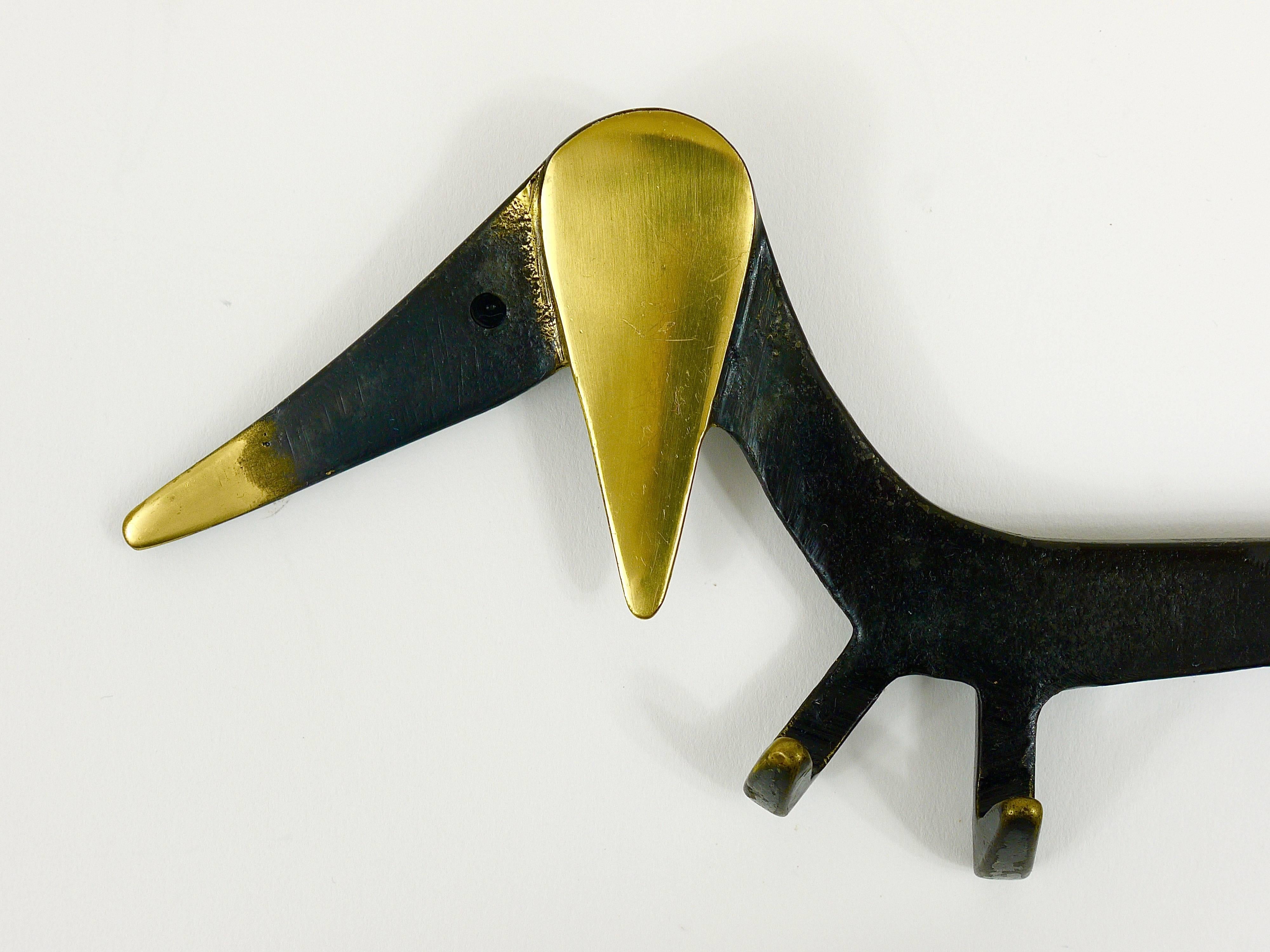 A charming and rare key holder, displaying a Wiener dog, sausage dog. A humorous design by Walter Bosse, executed by Baller, Austria in the 1950s. Made of brass, in excellent condition.