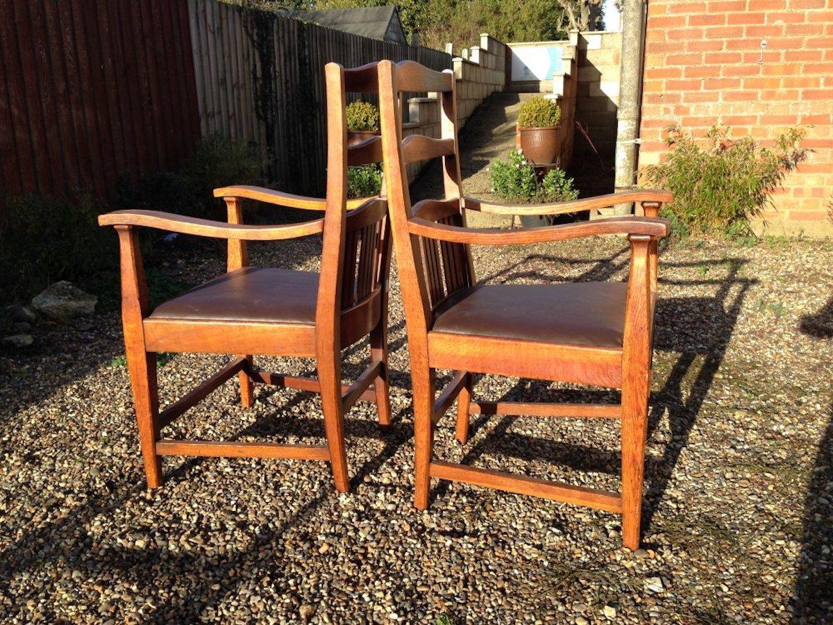 Arts and Crafts Walter Cave Attri. a Pair of Arts & Crafts Oak Armchairs with Curvaceous Backs For Sale