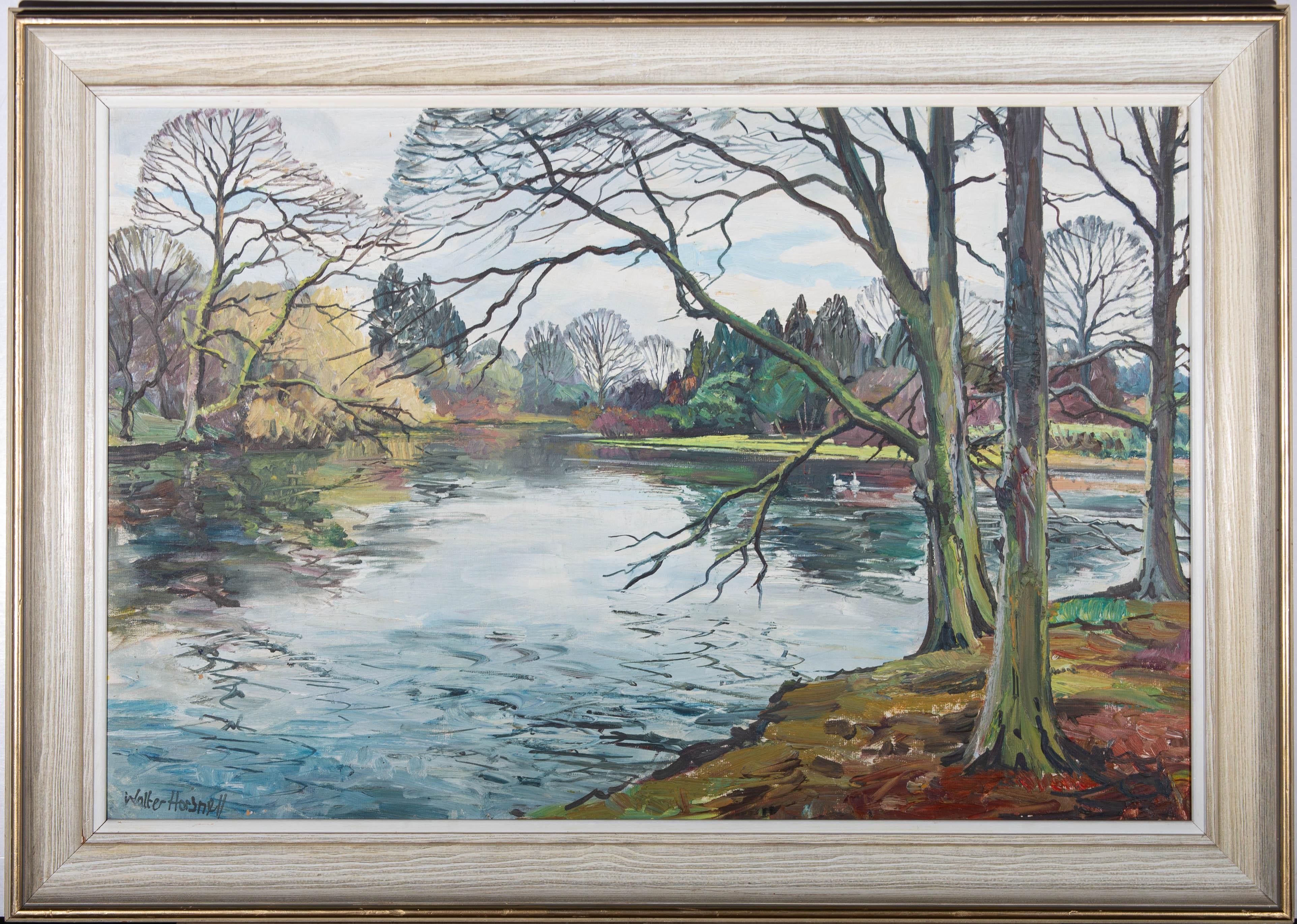 A fine 20th Century oil landscape in an expressive impressionistic style with flashes of vibrant colour. The scene shows a glassy lake in beautiful parkland with the bank lined with trees. The stark branches of the bare trees are reflected in the