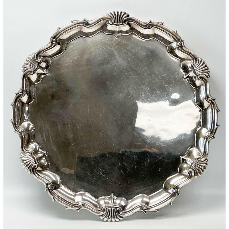 Walter & Charles Sissons England sterling silver footed tray, 1899.

Additional information:
Composition: sterling silver 
Type: platters & trays
Dimension: 18.5 inches diameter x 1.75 inches
Condition: Very good condition, moderate scratches