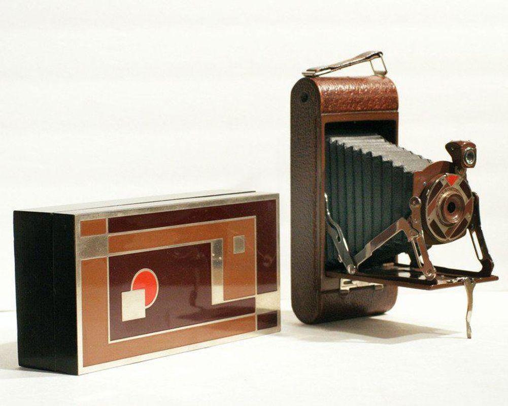 Walter Dorwin Teague (1883-1960) designed this Art Deco camera and box in 1930 for the Eastman-Kodak Company in Rochester, New York for the Christmas season. Known as the Kodak 