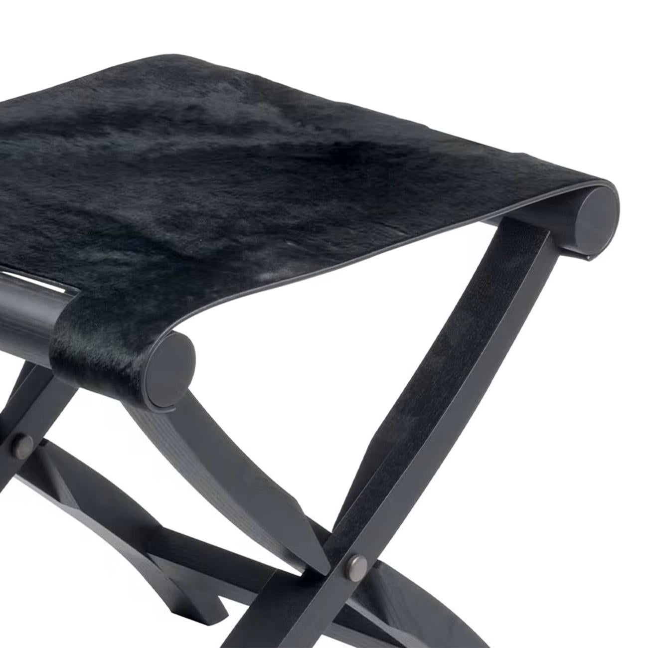 Stool walter folding with folding solid oak base in stained
blackened finish. With merinos wool seat in black finish.