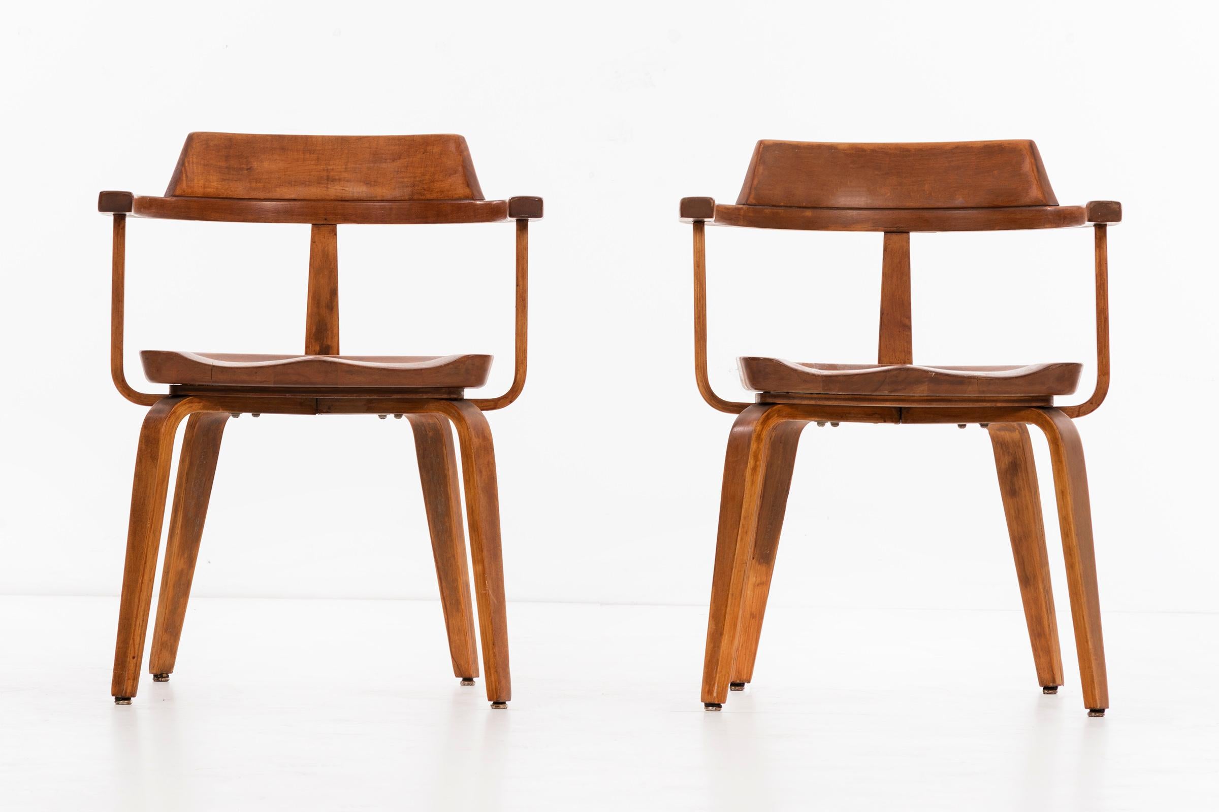 Walter Gropius for Thonet armchairs model W199, set of ten.
These have all been professionally restored to original tone and appearance
Stained and laminated birch.
 