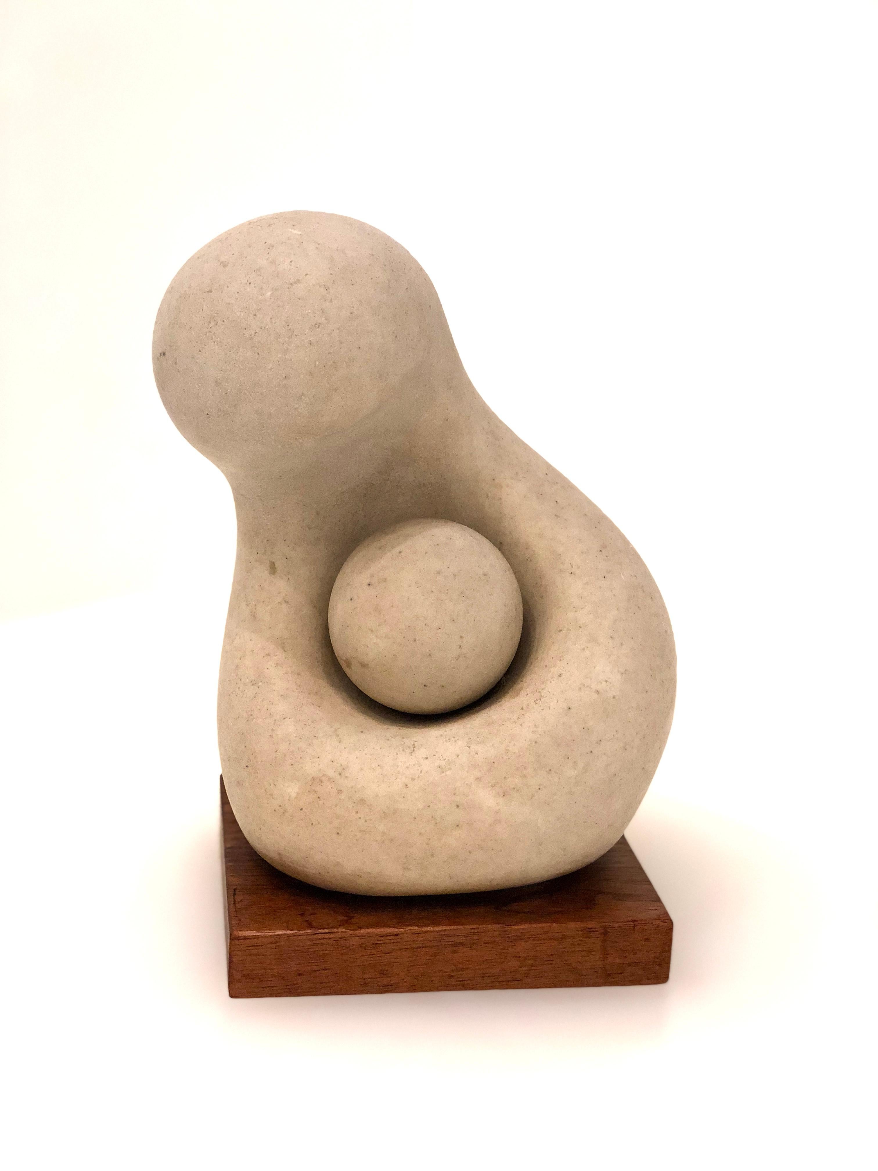 Beautiful small sculpture by Walter Hannula, original reproduction by Alva Studios of New York. Soapstone sitting on solid mahogany base in great condition. Signed in the back.