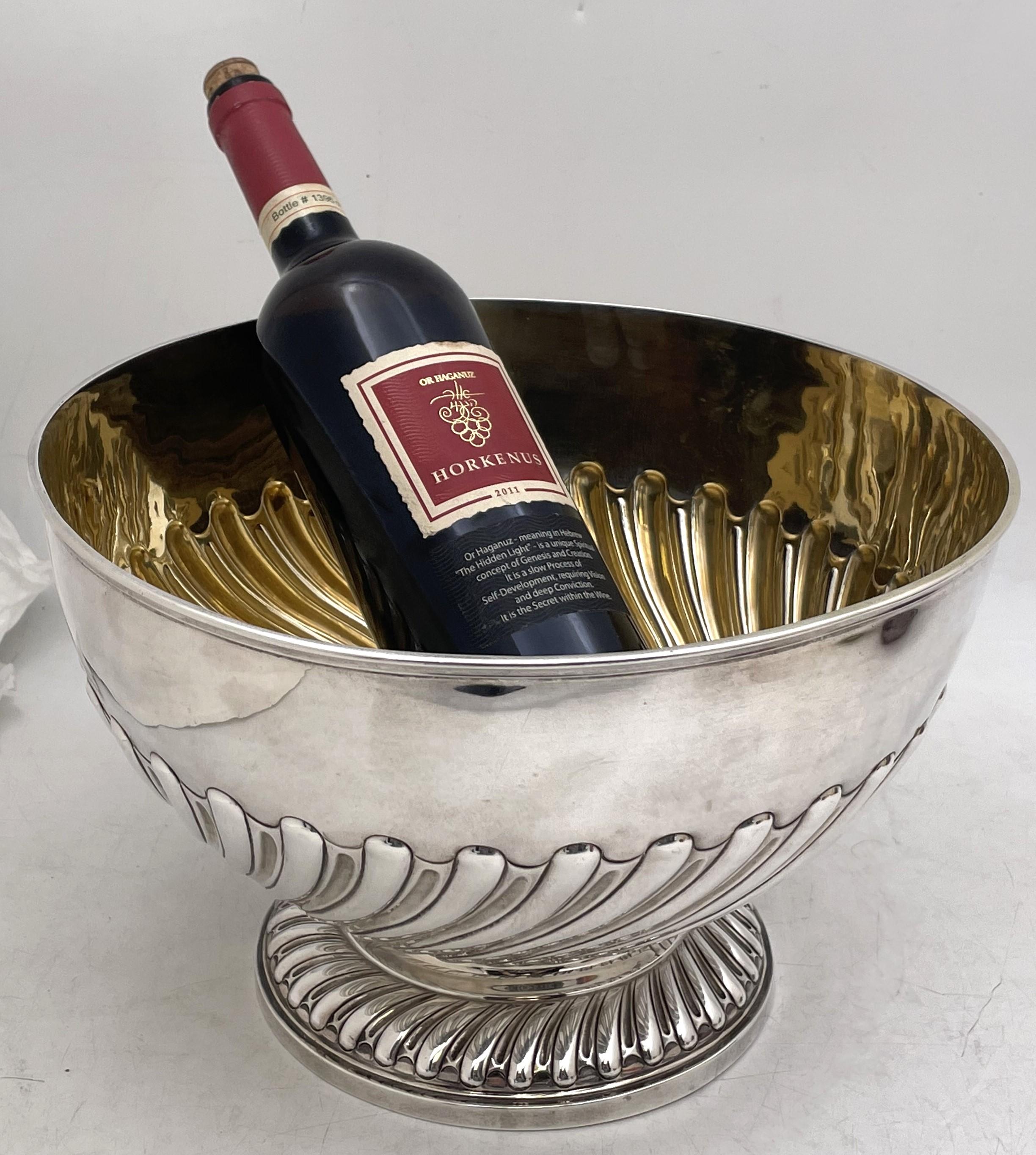 Walter and John Barnard sterling silver punch bowl or wine cooler, with curvilinear, fluted motifs adorning the base and body, gilt inside, from 1892 (Victorian era). It measures 11 1/2'' diameter by 8'' in height, weighs 33.7 troy ounces, and bears