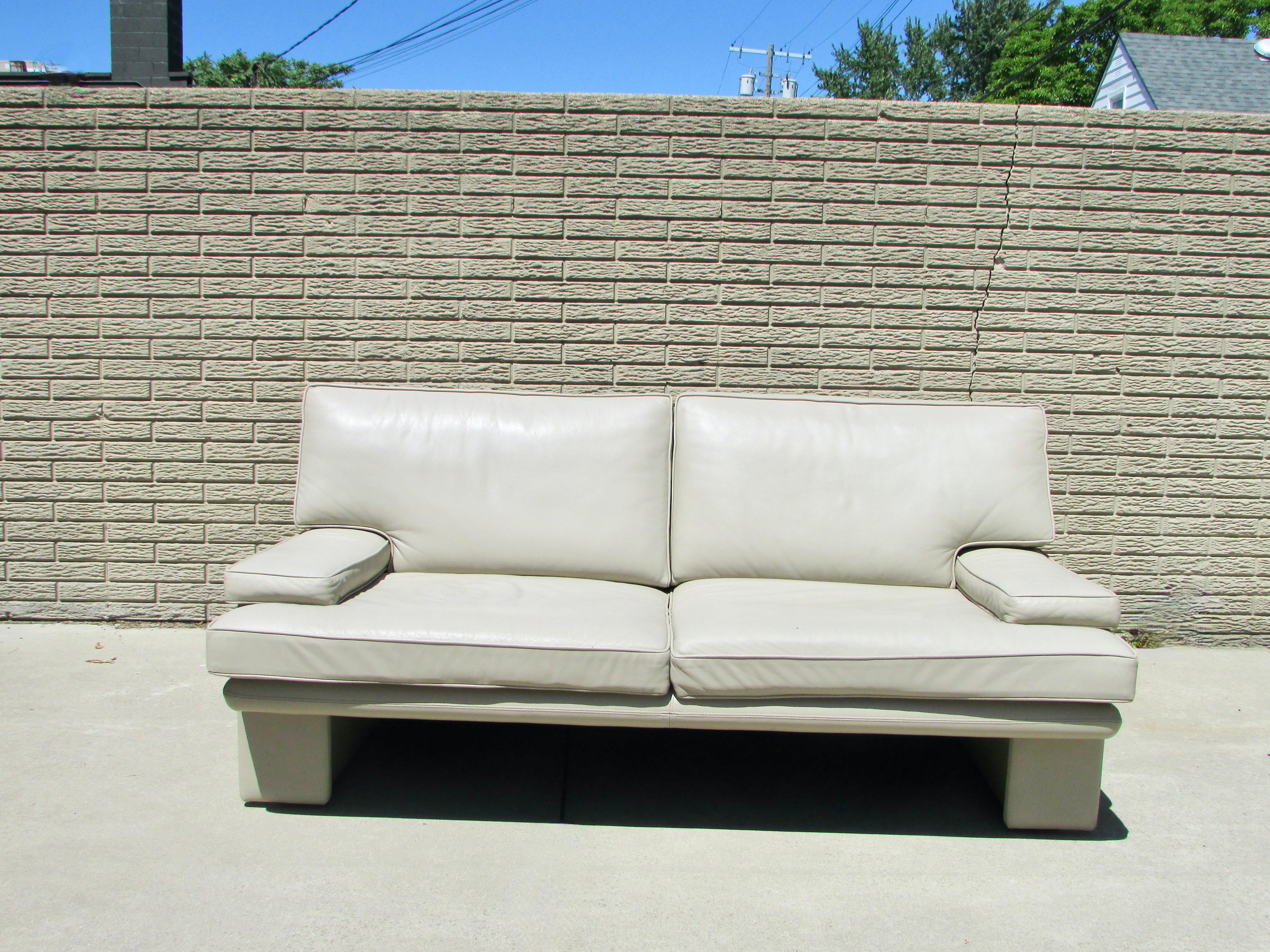 Beautifully stitched sand tone leather couch. Leather and cushions are in fine condition. Designed by Walter Knoll for Brayton international. Brayton was absorbed by steel case in the late eighties. This couch is probably early 80s production.