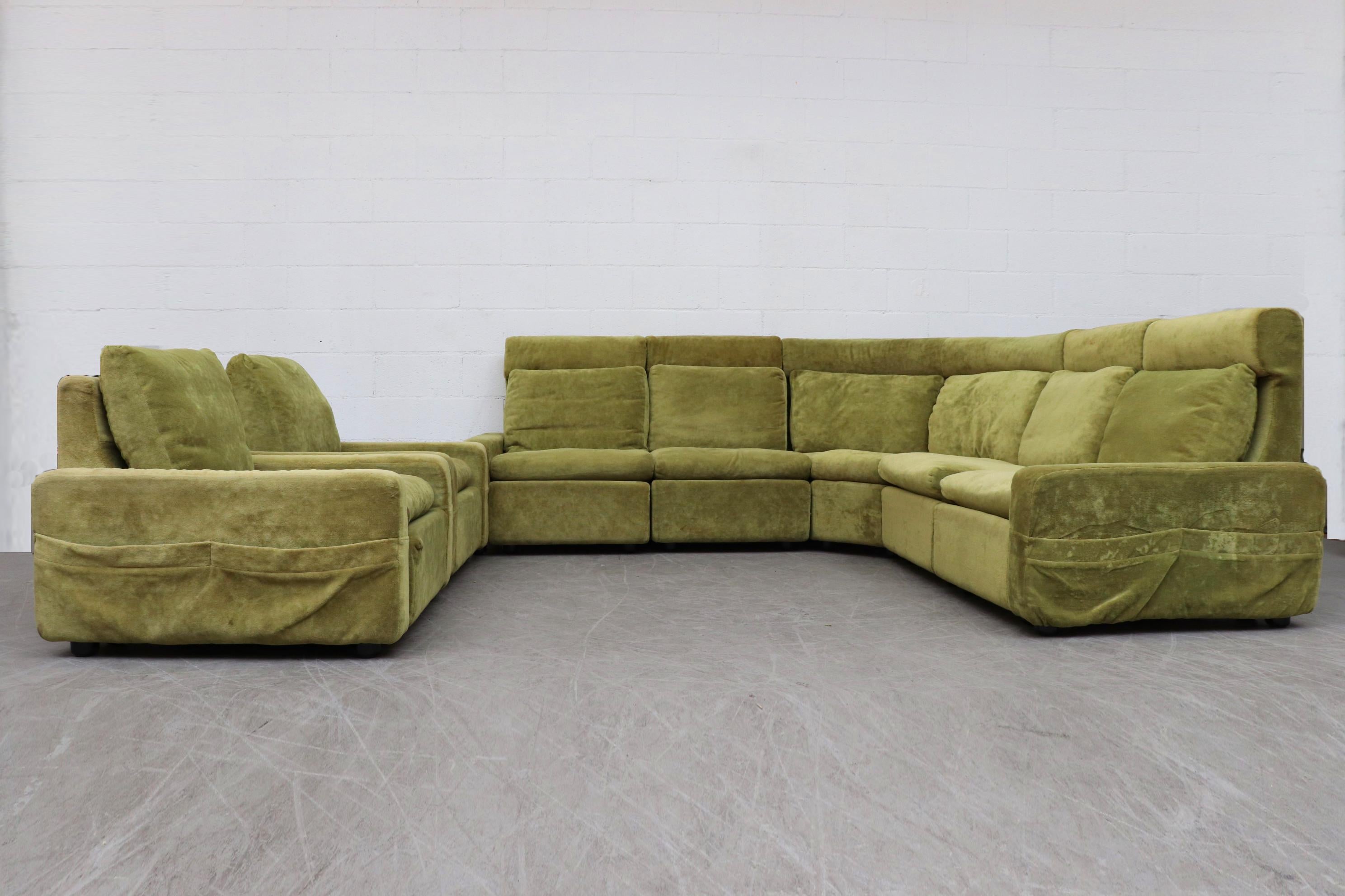 Walter knoll modular high back green sectional sofa. Fun avocado colored original upholstery with terry-cloth like texture. Sections can be linked together with metal fastens. End sections feature magazine pocket storage. In original condition with