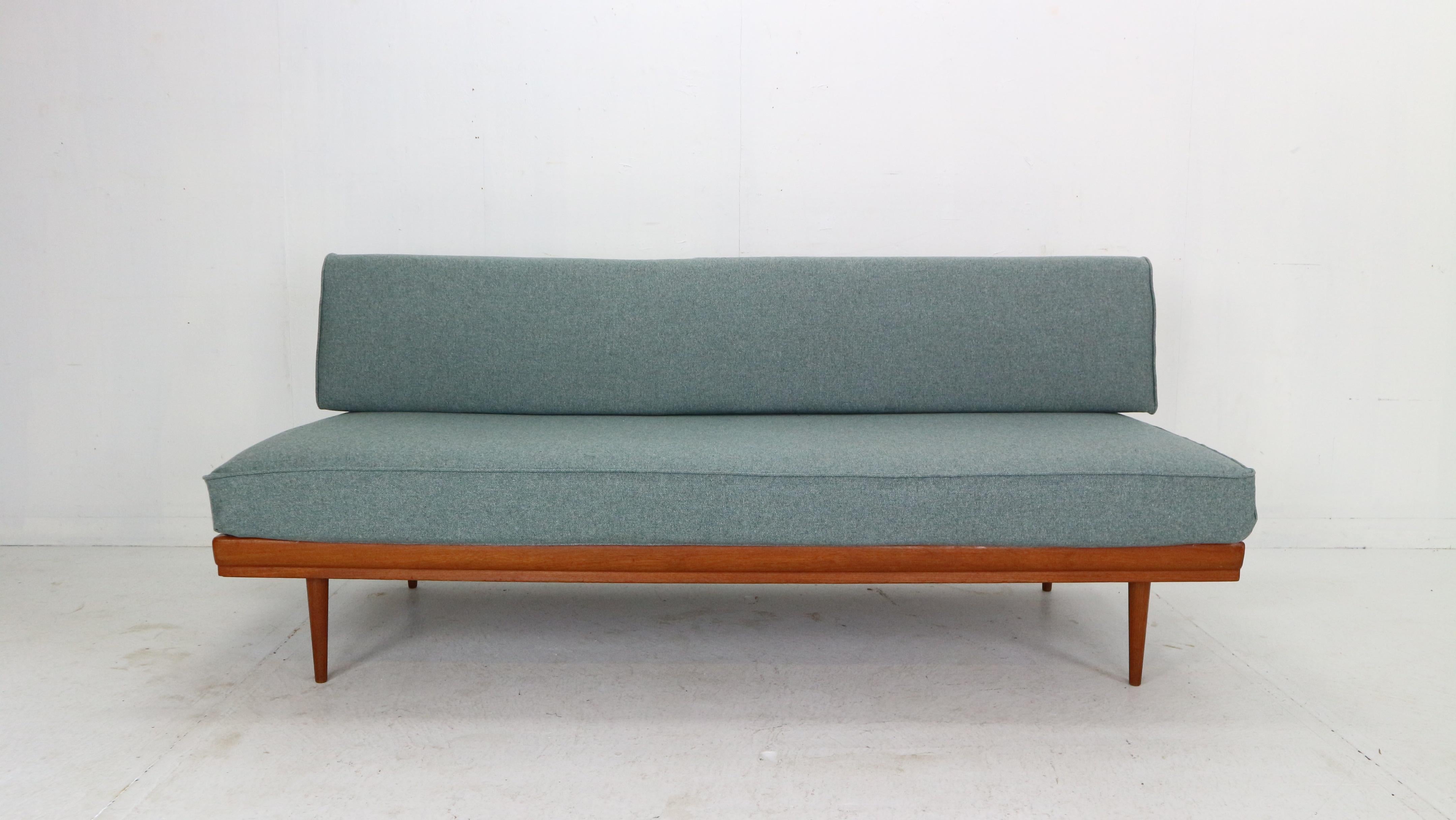 This sofa daybed was designed by Walter Knoll for Knoll Antimott in the 1950s Germany. 
Frame is made from solid teak wood and both cushions are upholstered in a new furniture wool fabric.
You can adjust the backrest and easily make from sofa to
