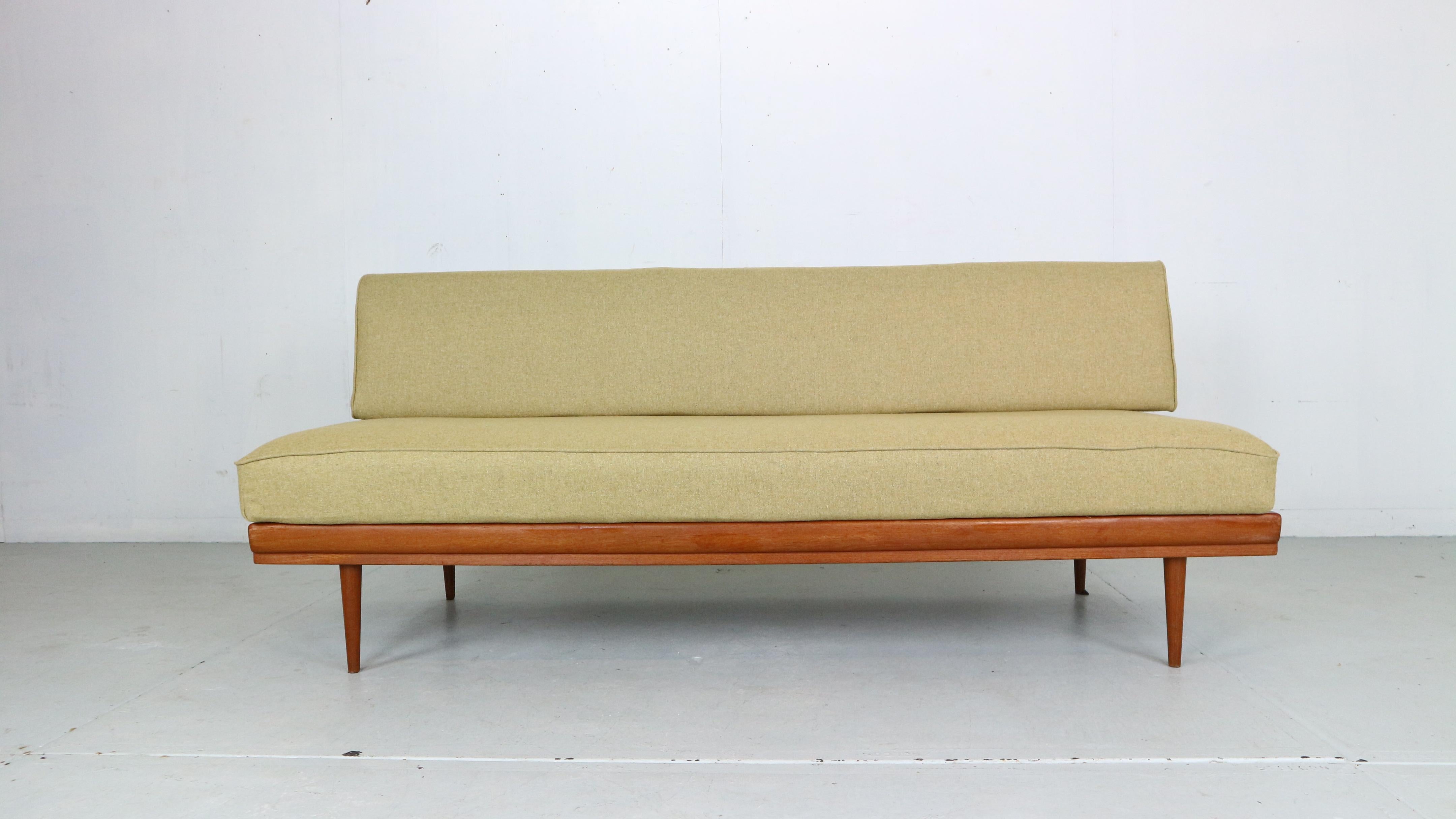 This sofa daybed was designed by Walter Knoll for Knoll Antimott in the 1950s Germany. 
Frame is made from solid teak wood and both cushions are upholstered in a new furniture wool fabric.
You can adjust the backrest and easily make from sofa to