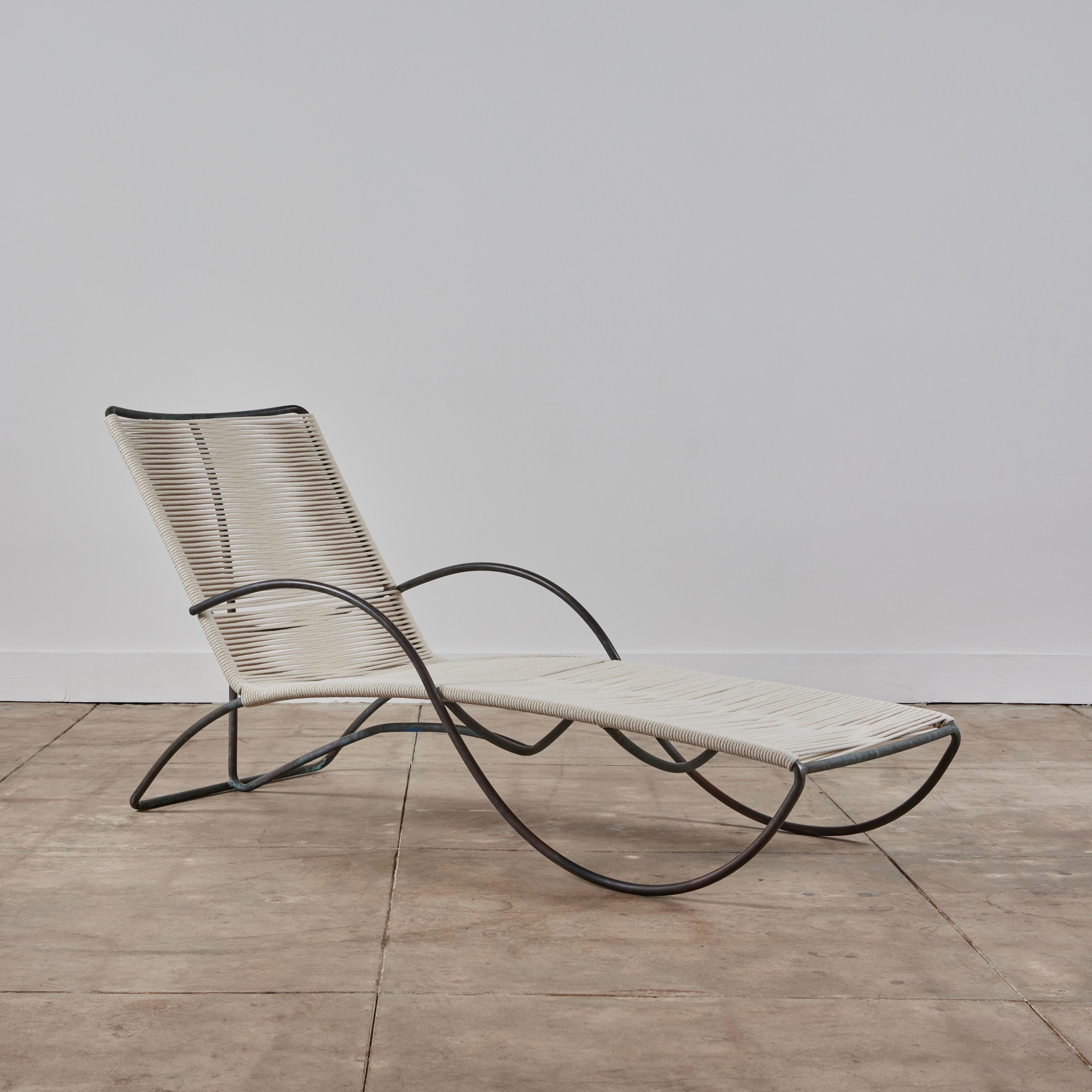 S-Lounge patio chair by Walter Lamb for Brown Jordan. Graceful even for a Lamb design, the chaise lounge is rendered in bronze tubing with a seat of woven yacht cord. Its namesake armrest draws a serpentine curve from the backrest to the front edge