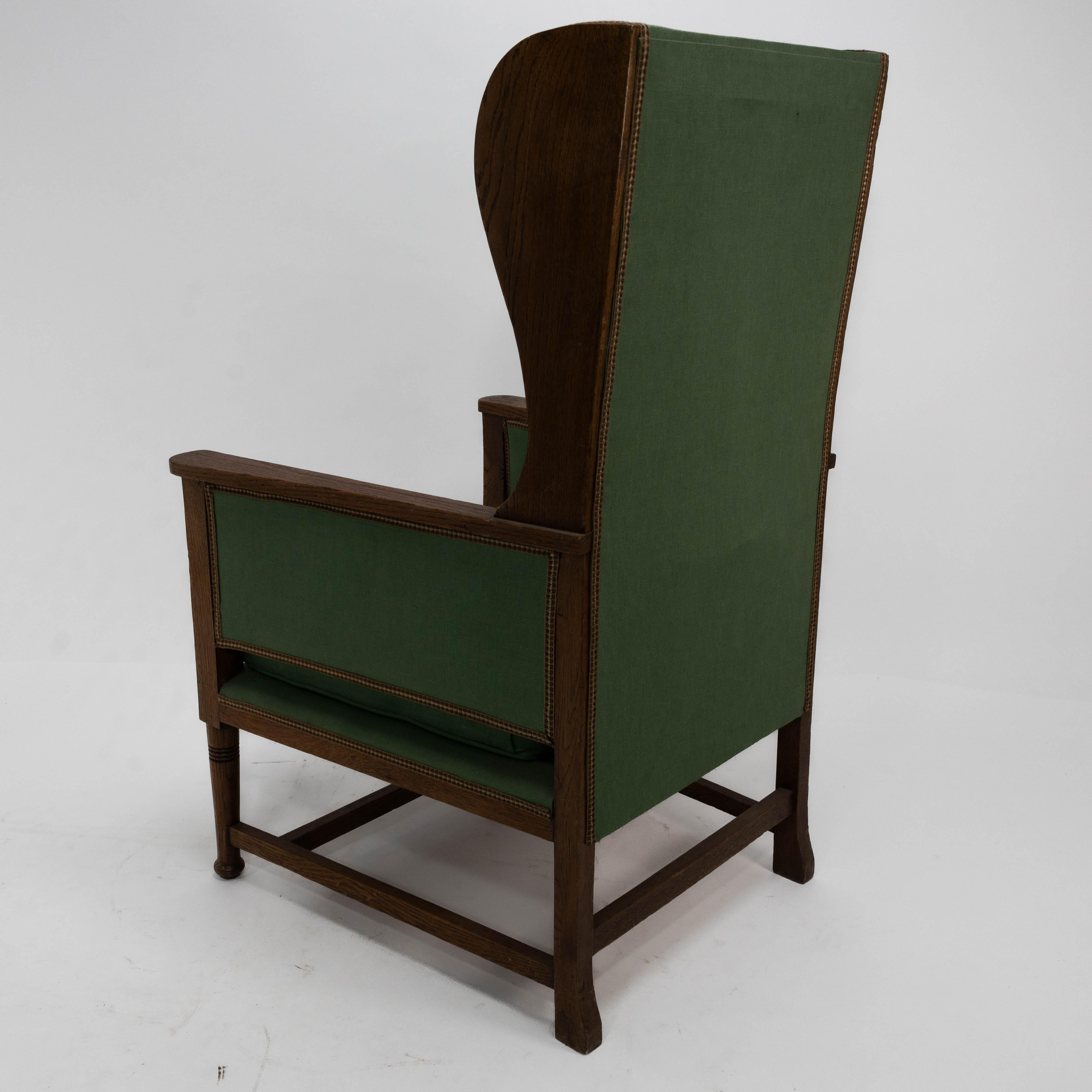 Walter Skull High Wycombe. An Arts and Crafts oak wing back upholstered armchair For Sale 4