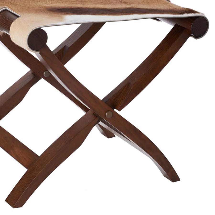 Folding stool walter springbok walnut with 
folding solid walnut base. With real springbok 
Skin seat.