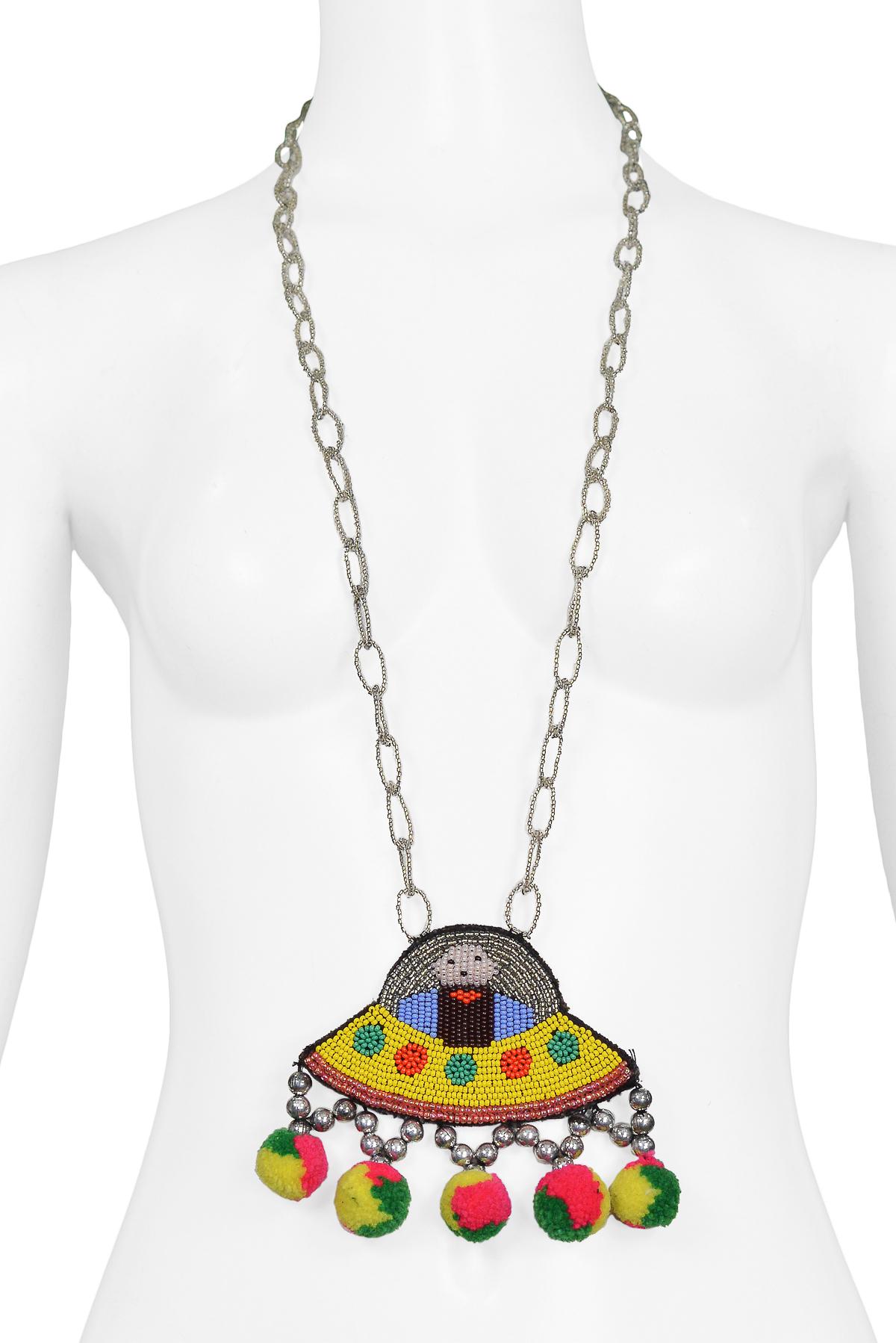 Resurrection Vintage is pleased to offer a vintage Walt flying saucer necklace featuring a long beaded chain, pom fringe, and logo label on the back. 

Walter Van Beirendonck
One Size
Beads, Felt
Excellent Vintage Condition
Authenticity Guaranteed 
