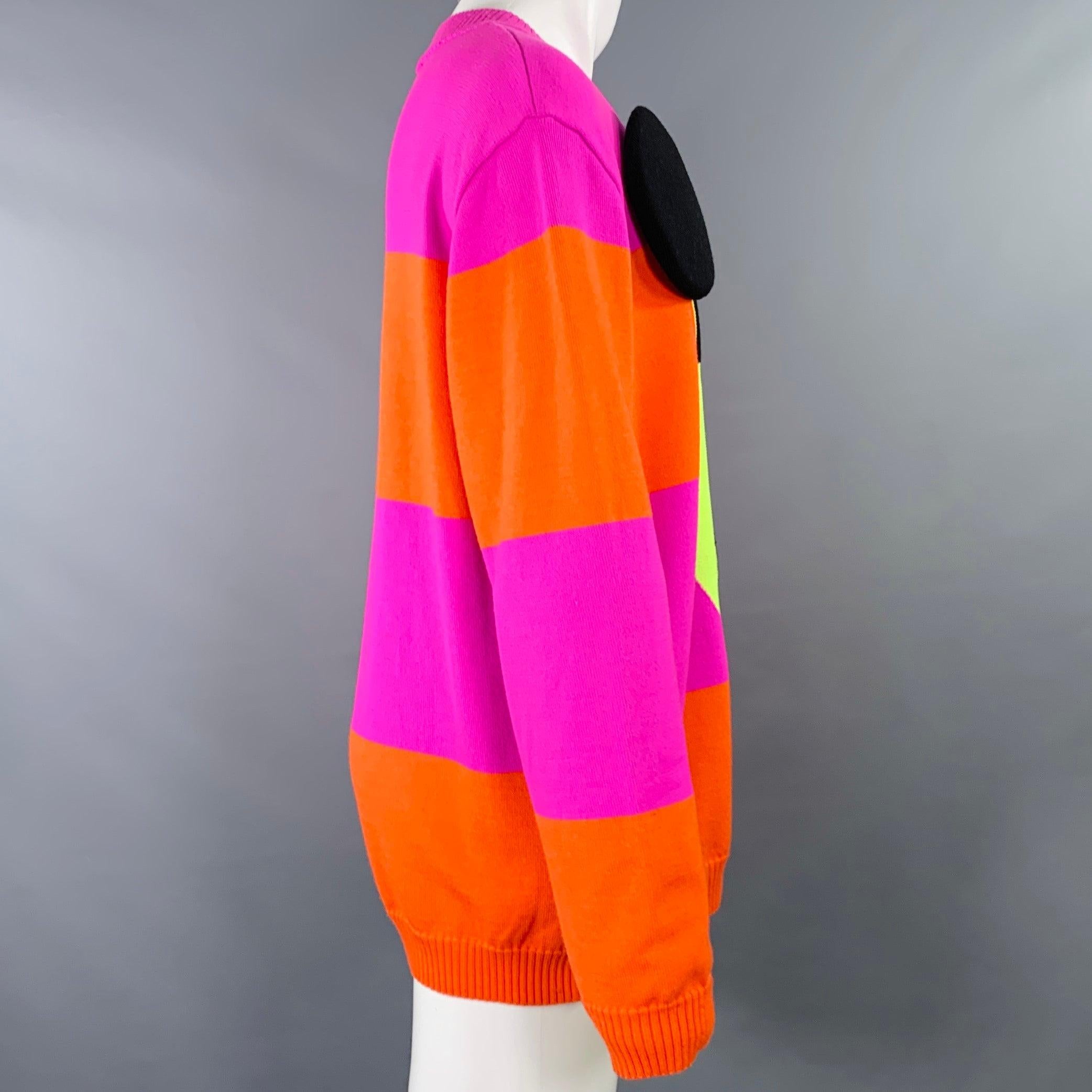 WALTER VAN BEIRENDONCK sweater
in a vibrant purple and orange merino wool knit featuring a stripe pattern, face design with padded 