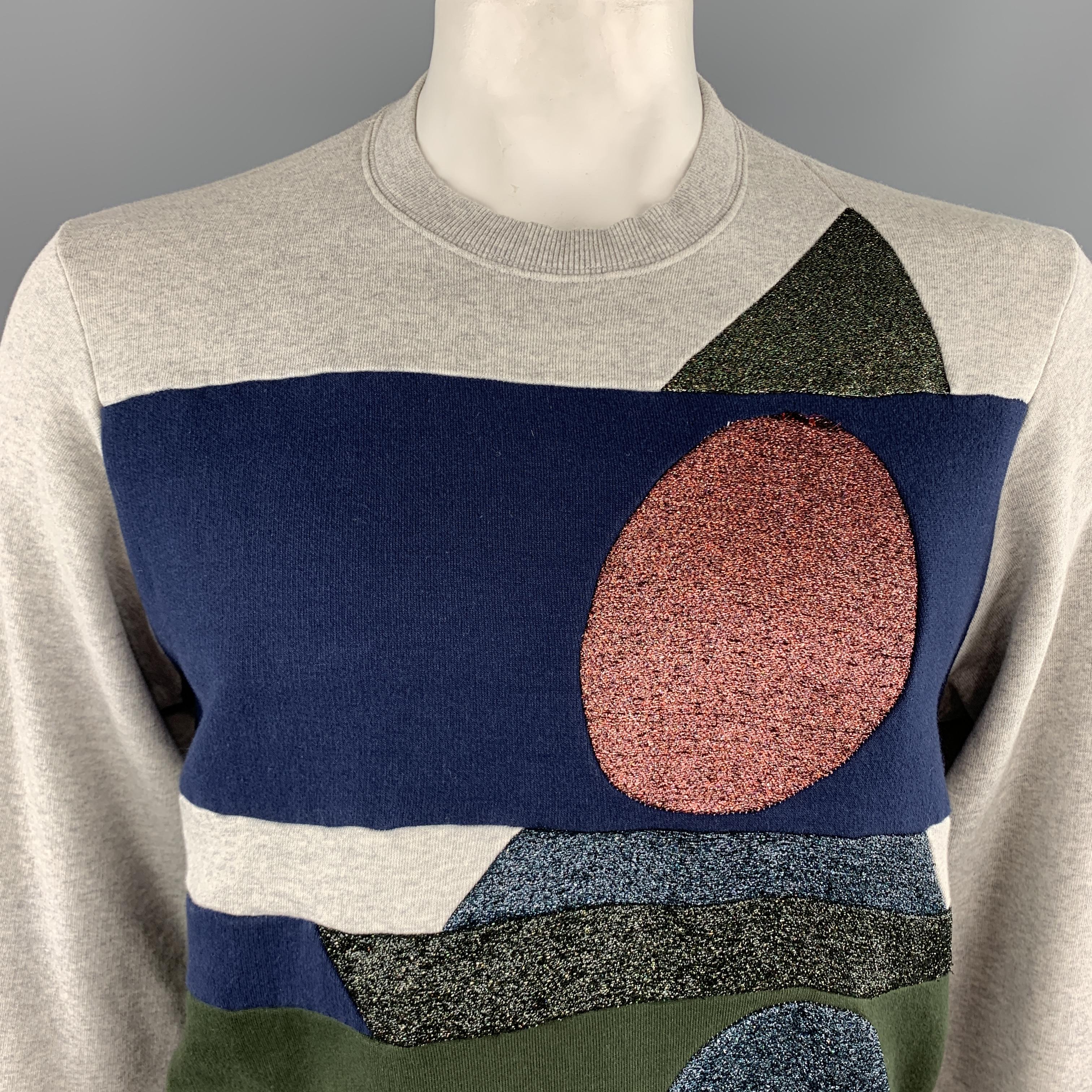 WALTER VAN BEIRENDONCK pullover sweatshirt comes in light heather gray jersey with navy and olive green color block patchwork stripes and sparkle knit geometric shapes panels. Wear throughout. As-is. Made in Italy.

Good Pre-Owned Condition.
Marked: