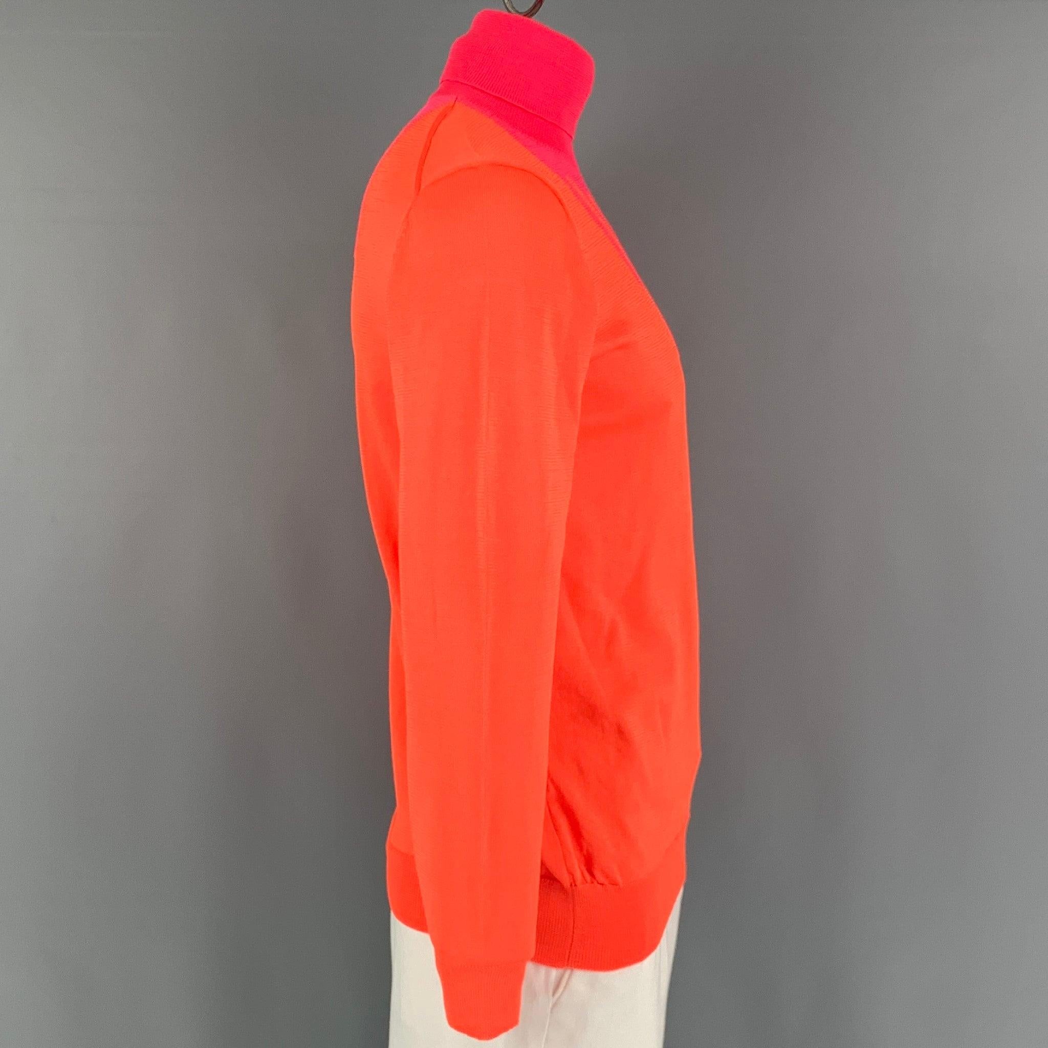WALTER VAN BEIRENDONCK Fall-Winter 2019 pullover comes in a orange and pink knitted material featuring a turtleneck. Made in Belgium. Excellent Pre-Owned Condition. 

Marked:   XXL 

Measurements: 
 
Shoulder: 19.5 inches Chest: 44 inches Sleeve: 26