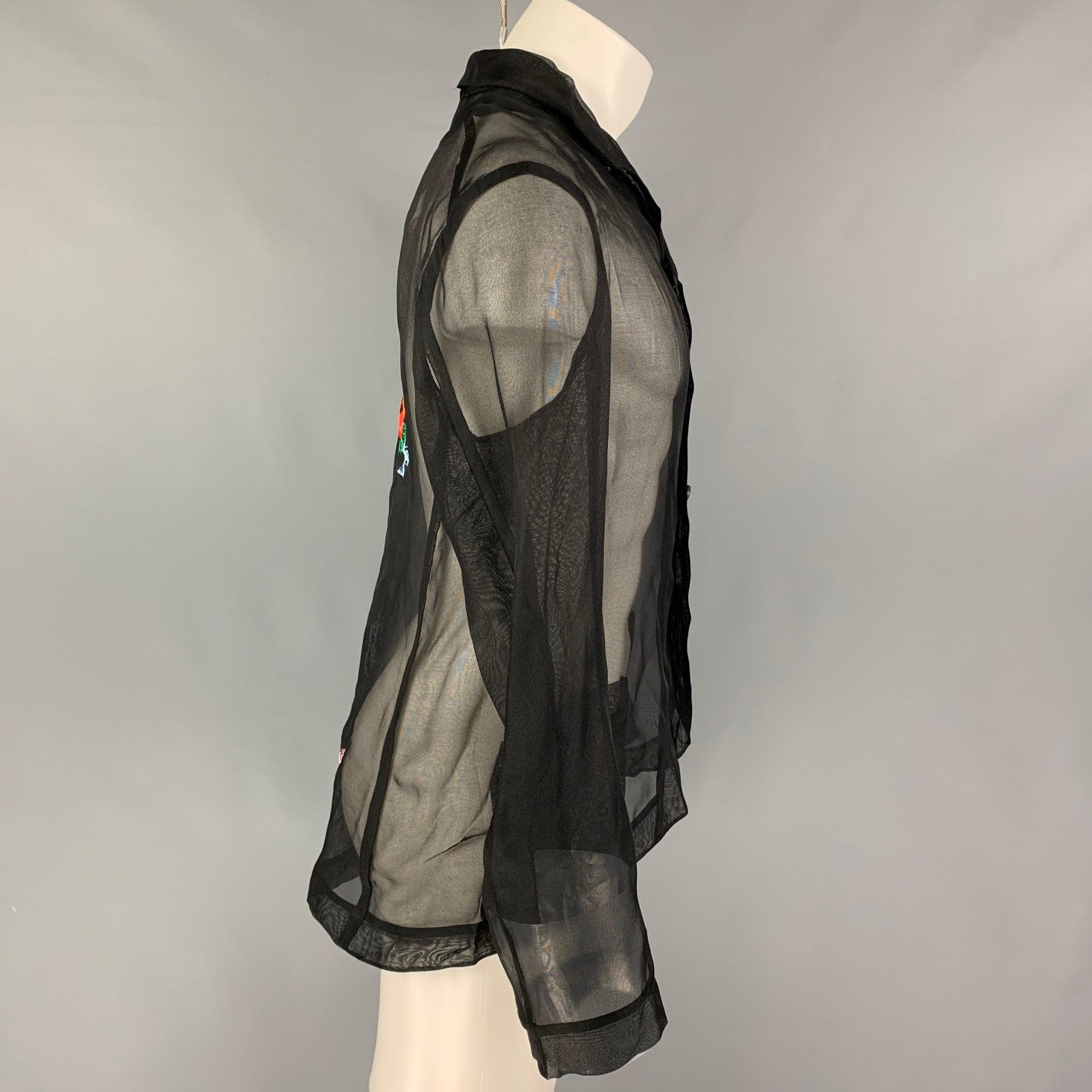 WALTER VAN BEIRENDONCK jacket comes in a black see through silk featuring a back multi-color embroidered design, notch lapel, patch pockets, and a buttoned closure. Made in Belgium.Excellent
Pre-Owned Condition.  

Marked:   48 

Measurements: 
