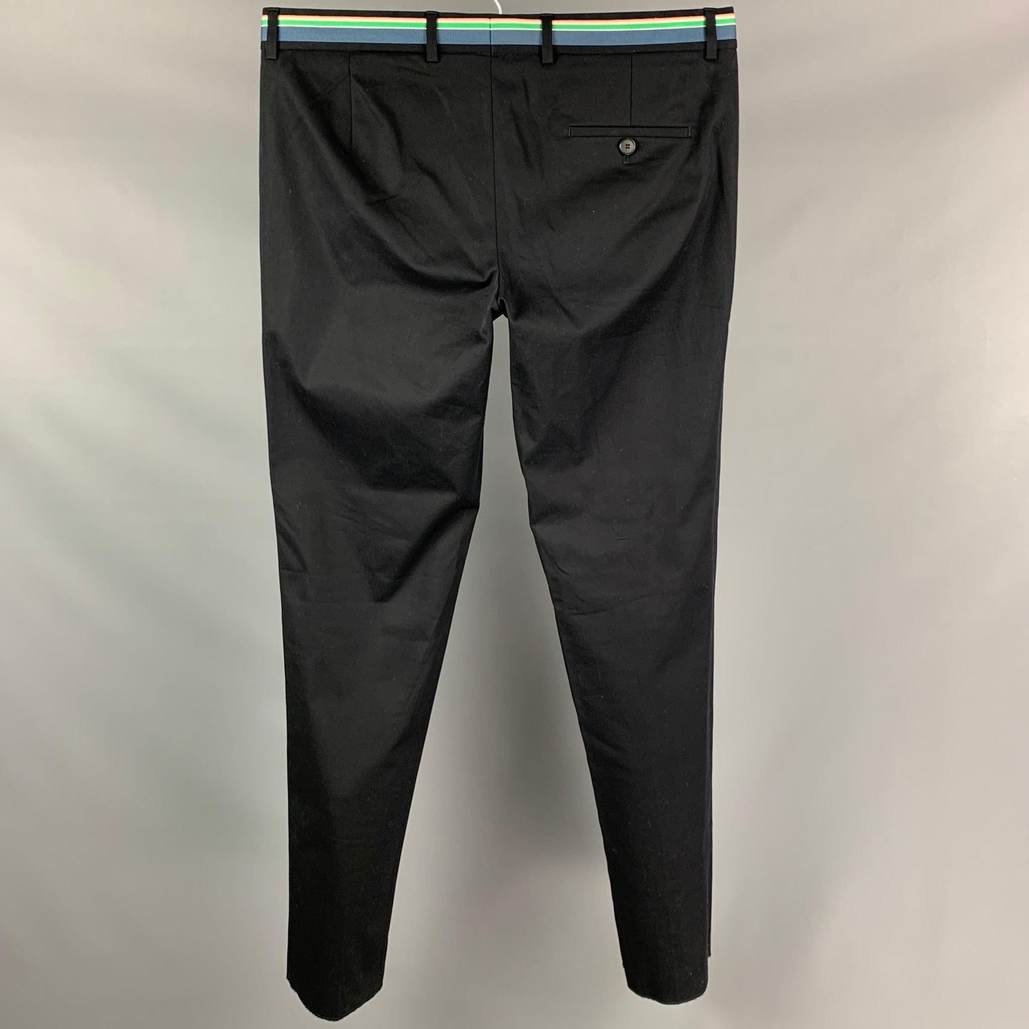 WALTER VAN BEIRENDONCK SS 17 dress pants comes in a black wool / polyester featuring a ribbon waistband design, flat front, front tab, and a zip fly closure.
Very Good
Pre-Owned Condition. 

Marked:   52 

Measurements: 
  Waist: 38 inches  Rise: 10