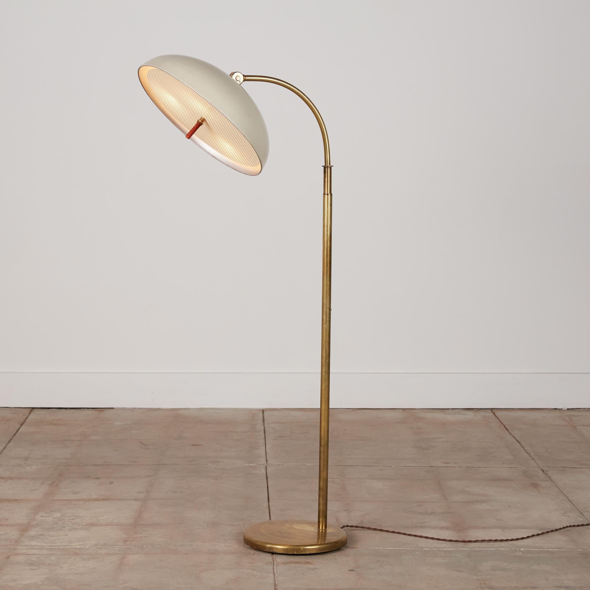 Walter von Nessen bronze floor lamp with flip-up shade and adjustable neck. The lamp features a perforated steel diffuser and a four way switch on the back of the dome.

Marked [Nessen + model number] on underside of base.

Dimensions: 16” width