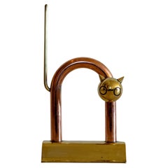 Walter Von Nessen, fermaporta "Gatto" in rame e ottone