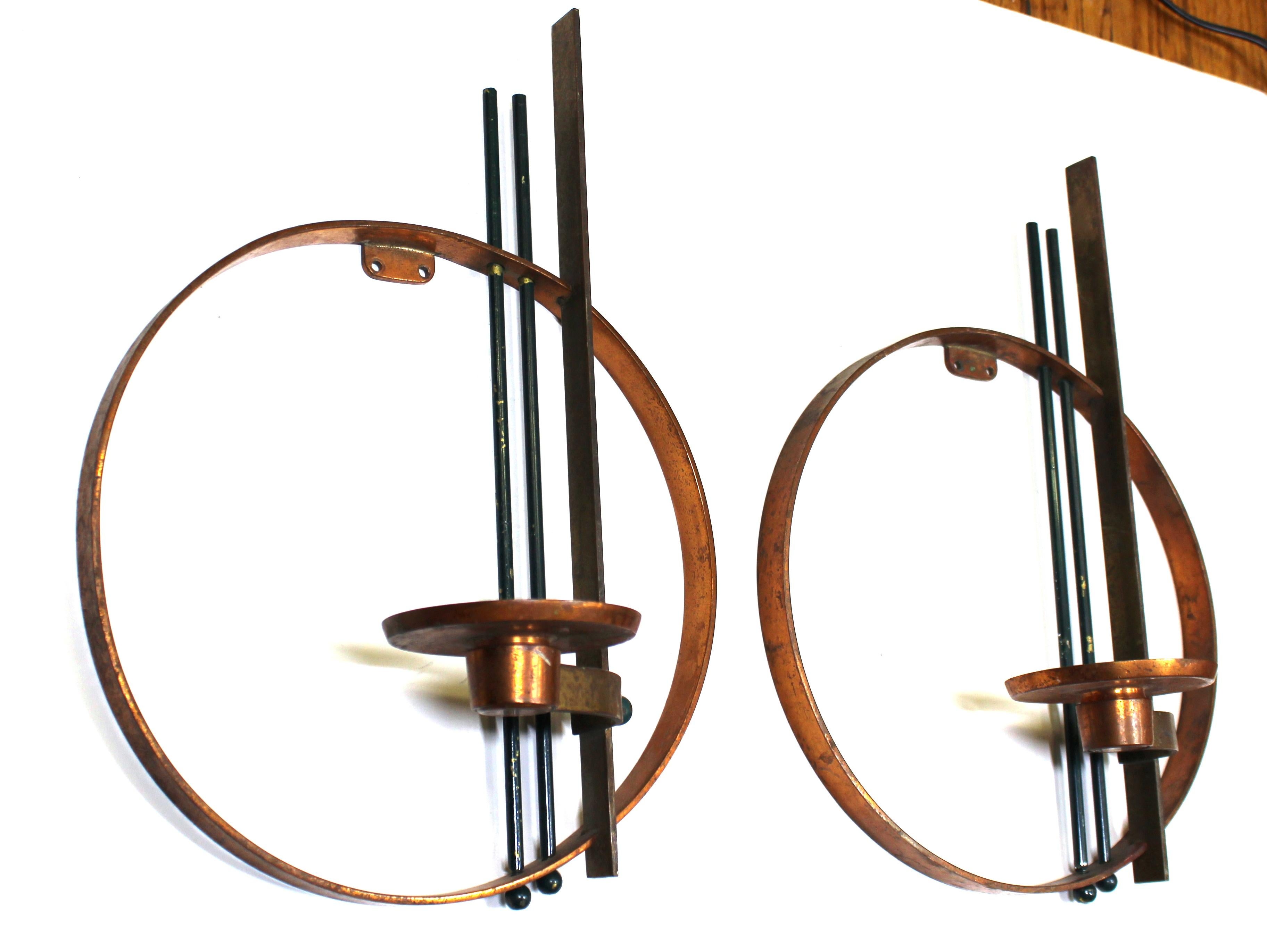 American Art Deco modernist pair of wall candle sconces in copper, enamel and brass, designed by Walter Von Nessen for Chase. The pair is in unused condition and was made during the mid-1930s in the United States. Chase makers mark on the back of
