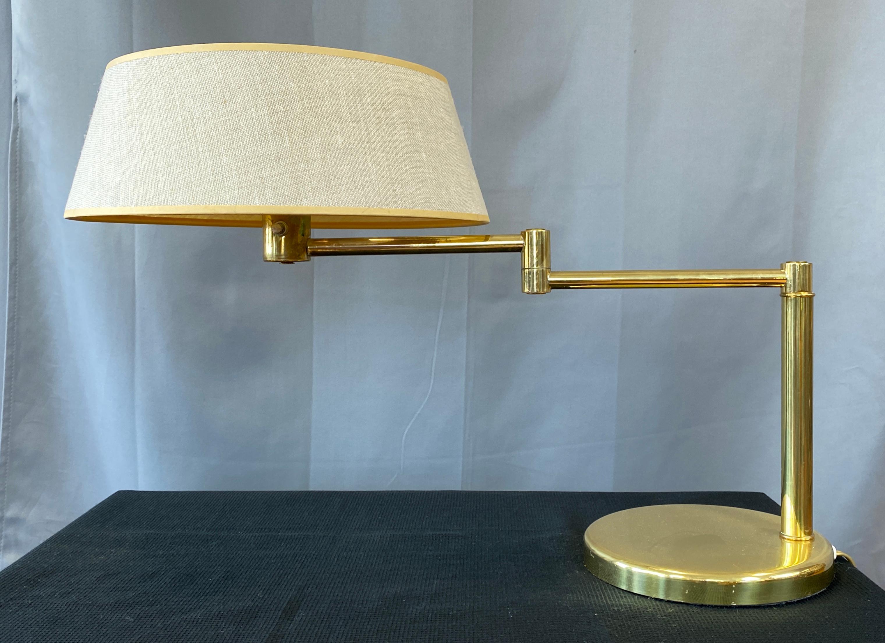 Handsome Walter Von Nessen design for Nessen lamps, circa 1970s 
A brass swing arm lamp with it's rare original shade, heavy weighted base with pole to one side,
arm stretches out, with half adjustable/swings. Nice touch, top of the shade it still