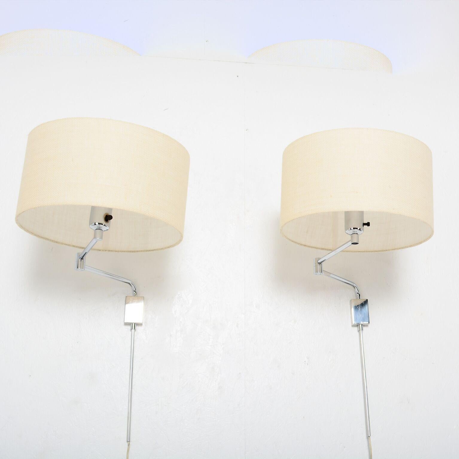 Chrome Wall Lamps
Pair of Mid-Century Modern Wall Sconces attributed to Walter Von Nessen.
No label. Circa 1970s.
Clean and Classic Look.
Nessen Lamps NYC. Chrome-plated body with milk glass shades. Linen Shades shown are for display only. Sale is