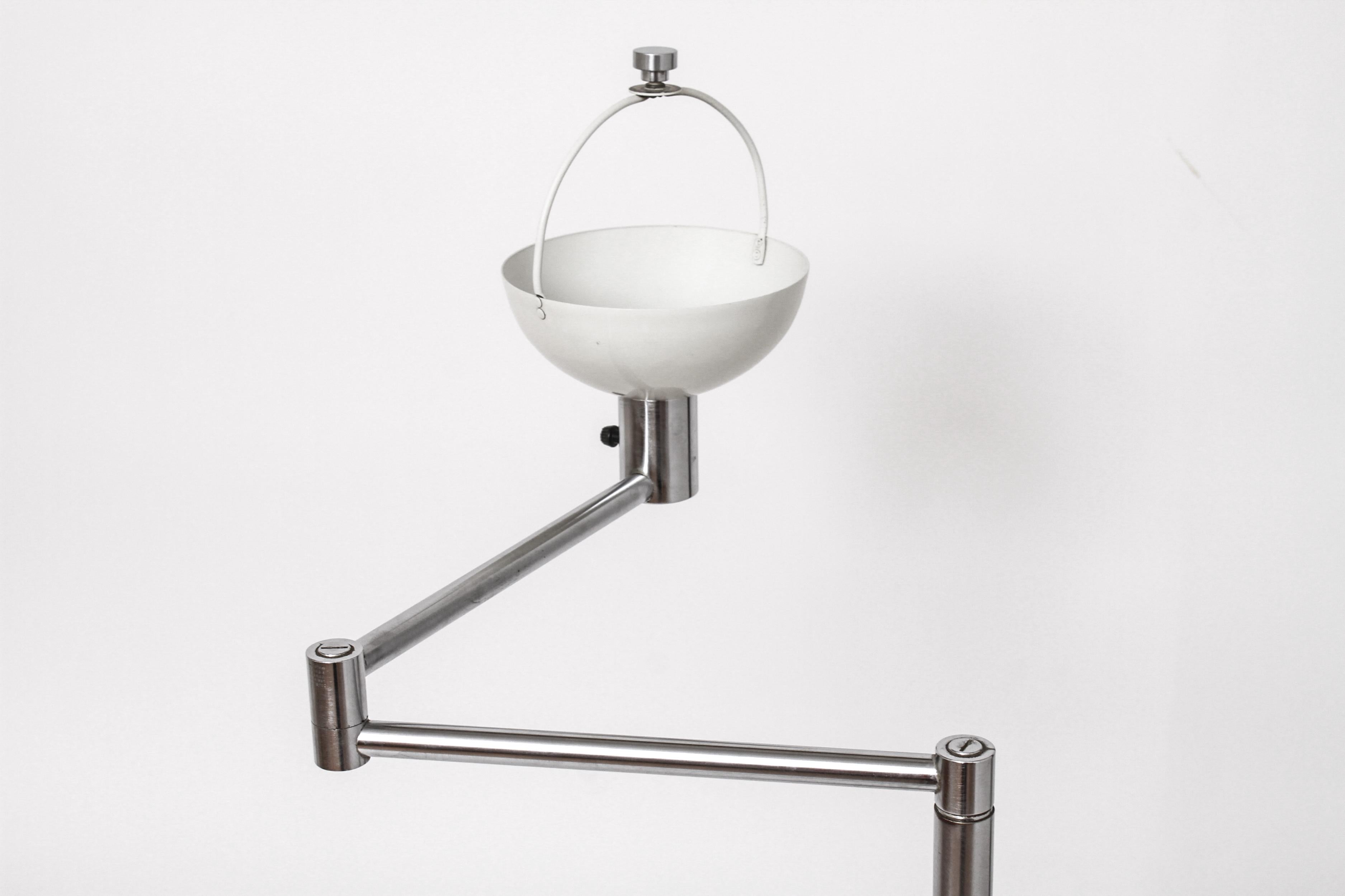 Walter Von Nessen for Nessen Studios modern floor lamp with adjustable swing arm, aluminum with basket-form metal shade, signed under weighted base 
