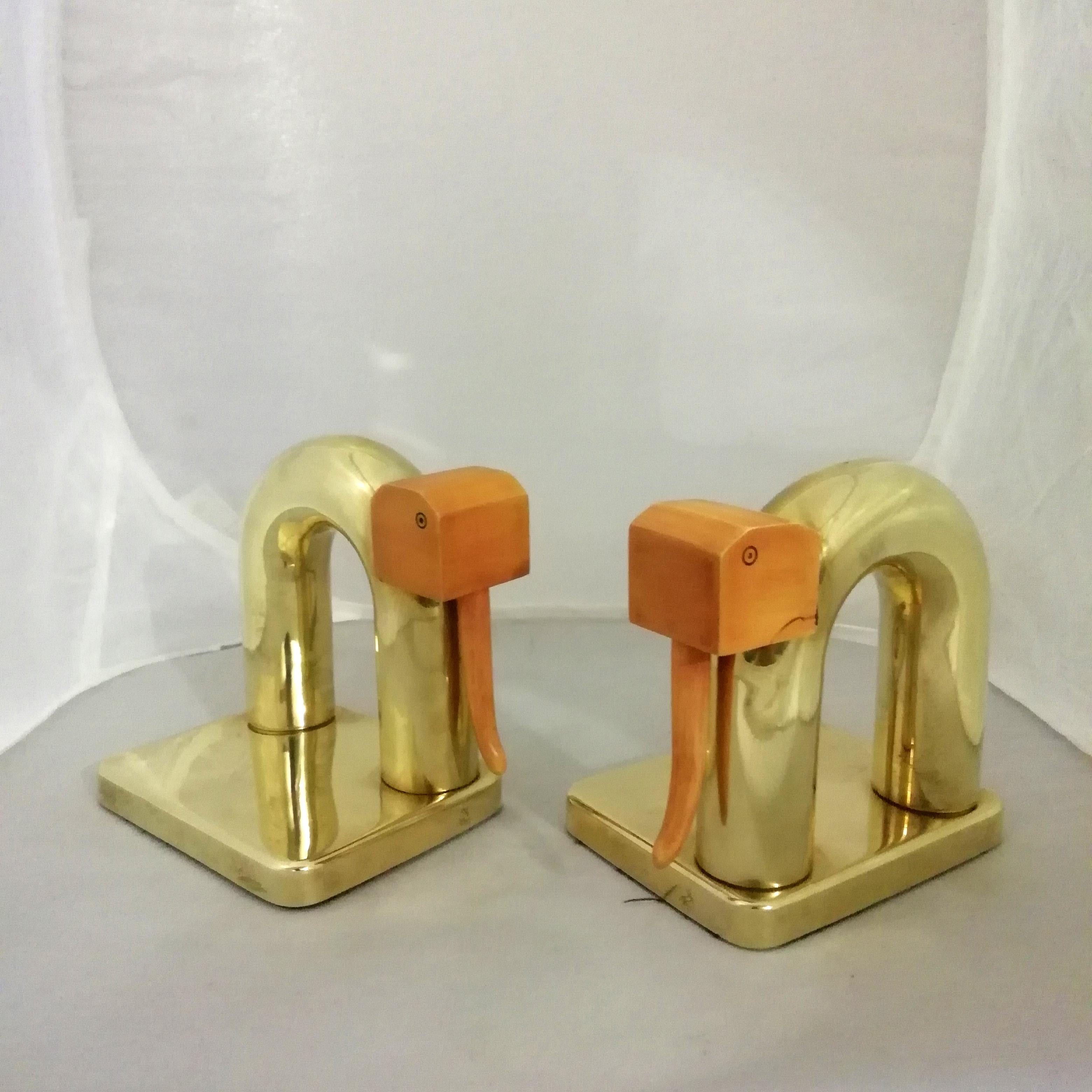 A pair of Art Deco brass bookend with bakelite heads in shape of elephants by German-born American designer Walter Von Nessen. Both pieces have the Chase Brass and Copper Company marks.