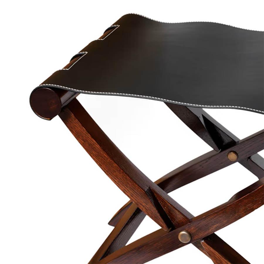 Folding stool walter walnut with folding solid 
walnut base. With genuine leather seat in black
finish.