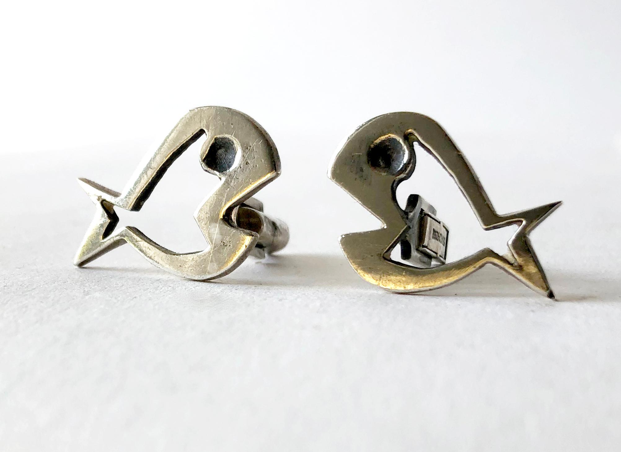 Sterling silver modernist fish cufflinks by Walter Wright, circa 1950's.  Cufflinks measure 3/4