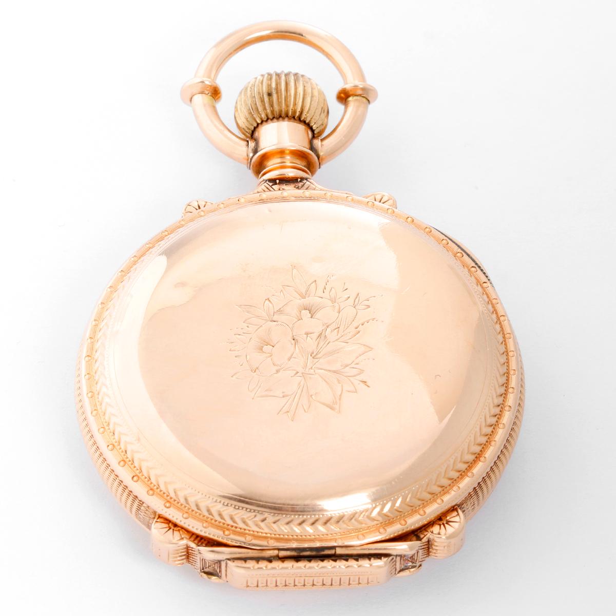 Waltham 14k Yellow Gold Box Hinge Pocket Watch - Manual winding. 14K Yellow gold case ( 54 mm) with beautiful engraving. White dial with Arabic numerals and ornate gold decorative swirls . Pre-owned with custom box .