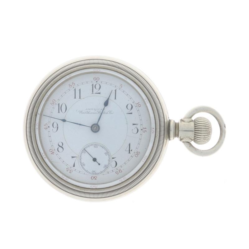 Brand: American Waltham Watch Co.
Model: 1883
Movement: Mechanical
Number of Jewels: 17
Year: 1896
Dial Color: White

Grade: Crescent St.
Size 18sMetal Content: Silver Toned

Style: Open Face
Features: 
Numbers marking the hours 
Sub