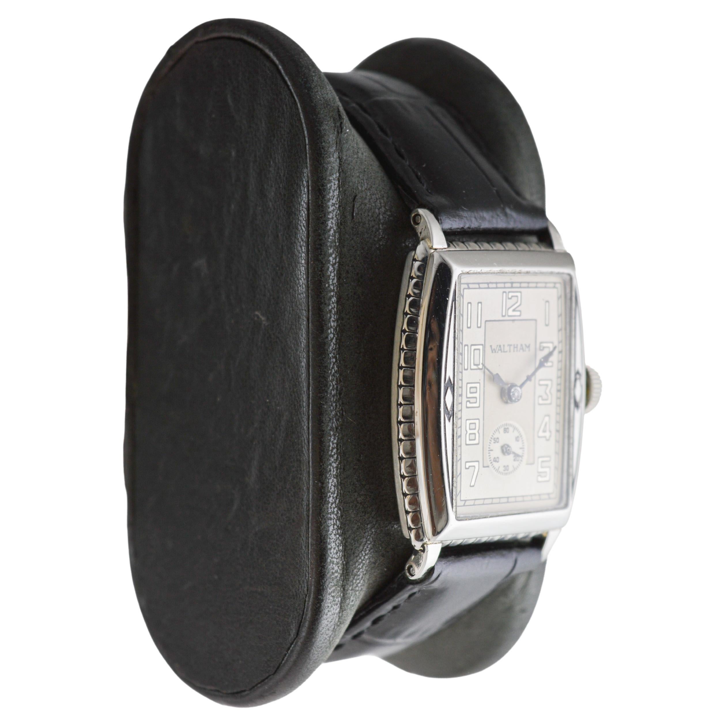 FACTORY / HOUSE: Waltham Watch Company
STYLE / REFERENCE: Art Deco / Tonneau Shape
METAL / MATERIAL: White Gold Filled
CIRCA / YEAR: 1926
DIMENSIONS / SIZE: Length 25mm X Width 36mm
MOVEMENT / CALIBER: Manual Winding / 15 Jewels / Caliber 10/0
DIAL