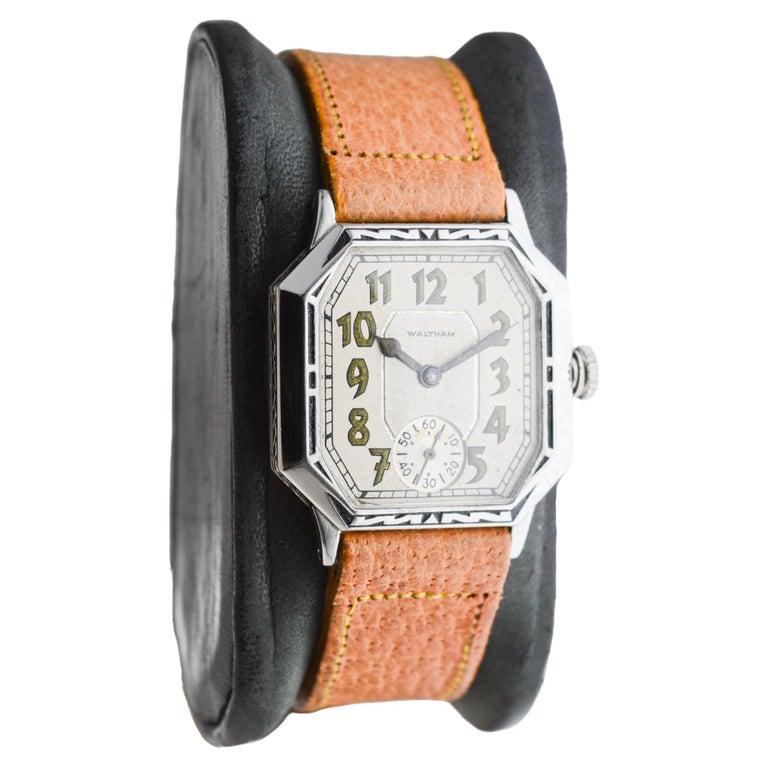 FACTORY / HOUSE: Waltham Watch Company
STYLE / REFERENCE: Art Deco  / Tank Style 
METAL / MATERIAL: White Gold Filled
CIRCA / YEAR: 1925
DIMENSIONS / SIZE: Length 26mm X Width 33mm
MOVEMENT / CALIBER: Manual Winding / 7 Jewels / Caliber 6/0
DIAL /