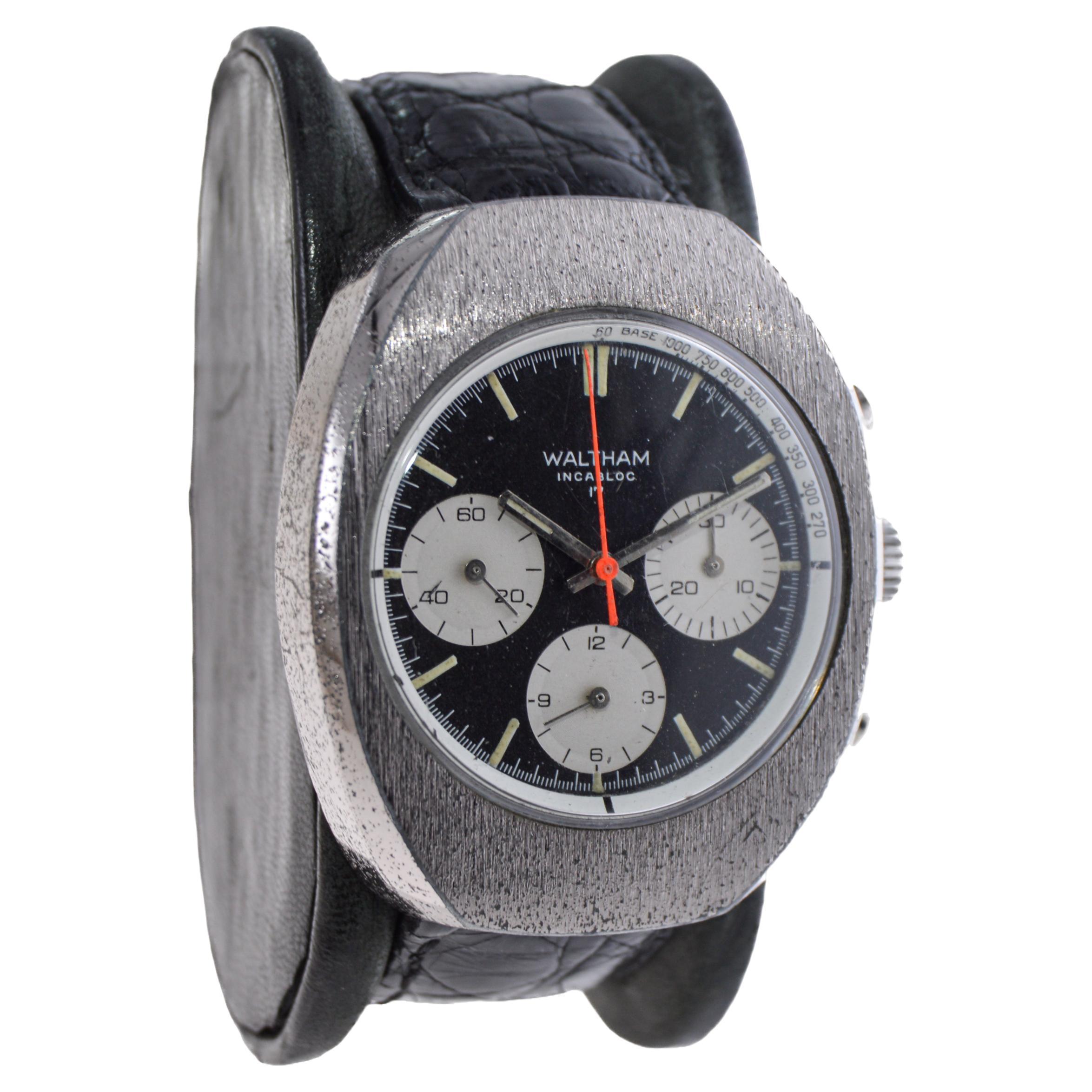 FACTORY / HOUSE: Waltham Watch Company
STYLE / REFERENCE: Chronograph / Tonneau Shaped
METAL / MATERIAL: Chromium on Bronze
CIRCA: 1960's
DIMENSIONS: Length 46mm X Width 38mm
MOVEMENT / CALIBER: Manual Winding / 17 Jewels 
DIAL / HANDS: Original