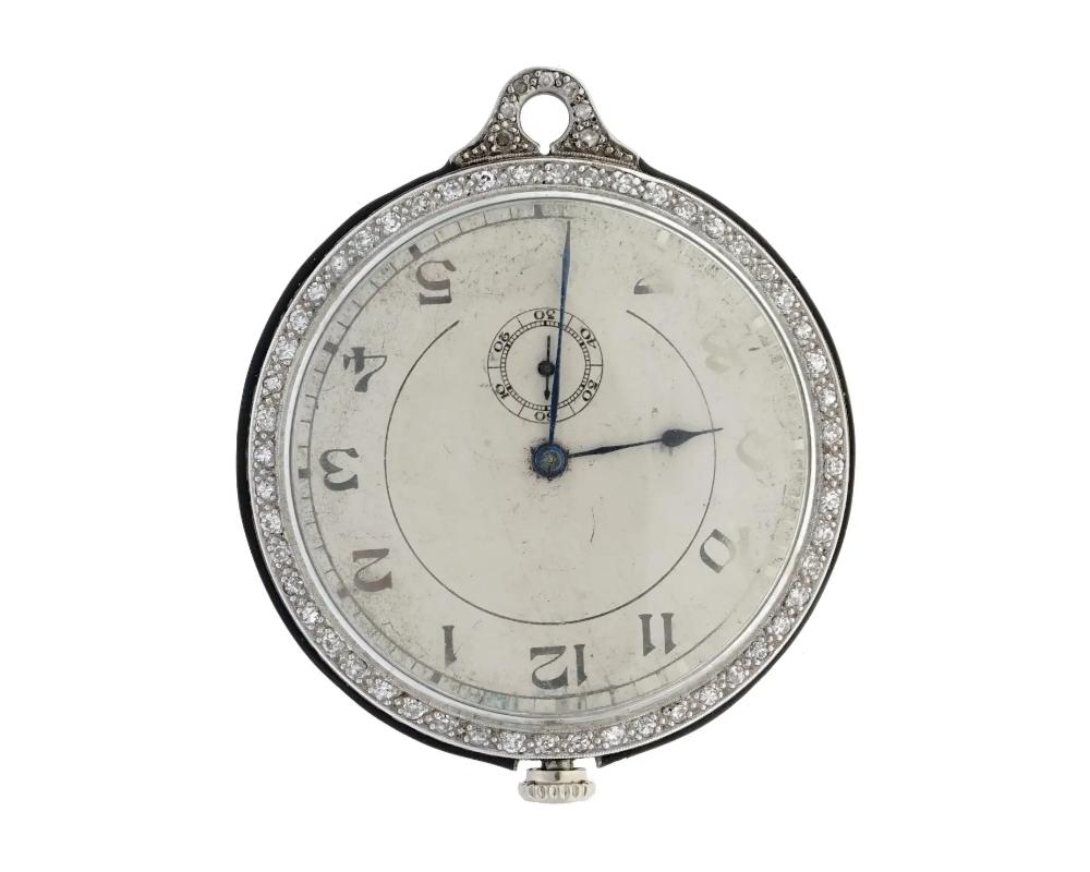 An American Waltham Watch Co Ruby stones and Platinum pocket watch made in the Art Deco manner. A white enameled dial with black Arabic numerals. The case is encrusted with Diamonds. Marked with a Waltham Watch Co mark, Adjusted, Patented, Ruby