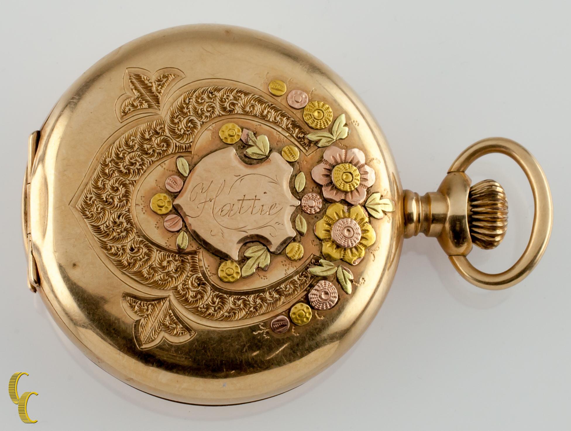 Beautiful Antique Waltham Pocket Watch w/ White Dial Including Cobalt Blue Hands & Dedicated Second Dial
14k Yellow Solid Gold Case w/ Intricate Multi-Color Gold Overlay Design on Front of Case
Same Design w/ Diamond Solitaire on Reverse
Black Roman