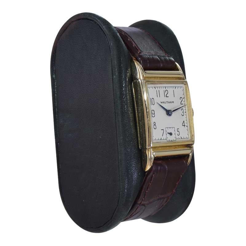 FACTORY / HOUSE: Waltham Watch Company
STYLE / REFERENCE: Art Deco 
METAL / MATERIAL: Yellow Gold Filled 
CIRCA / YEAR: 1940's
DIMENSIONS / SIZE: Length 35mm x Width 21mm
MOVEMENT / CALIBER: Manual Winding / 17 Jewels / Caliber 750B
DIAL / HANDS: