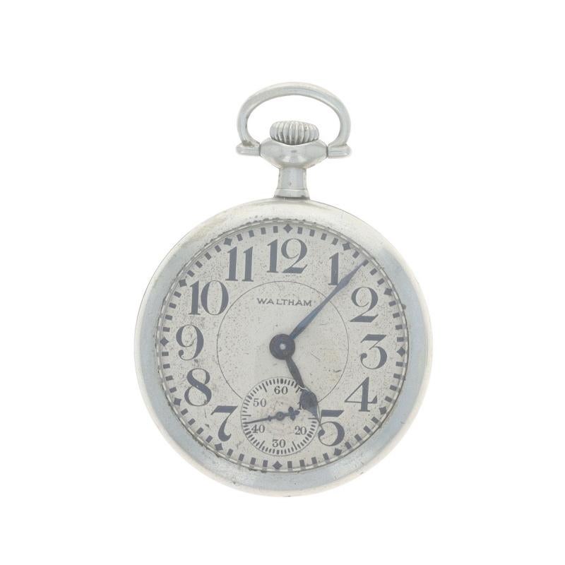 Marke: Waltham
Modell: 1908
Uhrwerk: Mechanisch
Anzahl der Juwelen: 7
Jahr: 1924
Hersteller des Uhrwerks: Vereinigte Staaten
Zifferblattfarbe: Creme

Klasse: 610 
Größe: 16s 

Metallgehalt: Silber getönt 