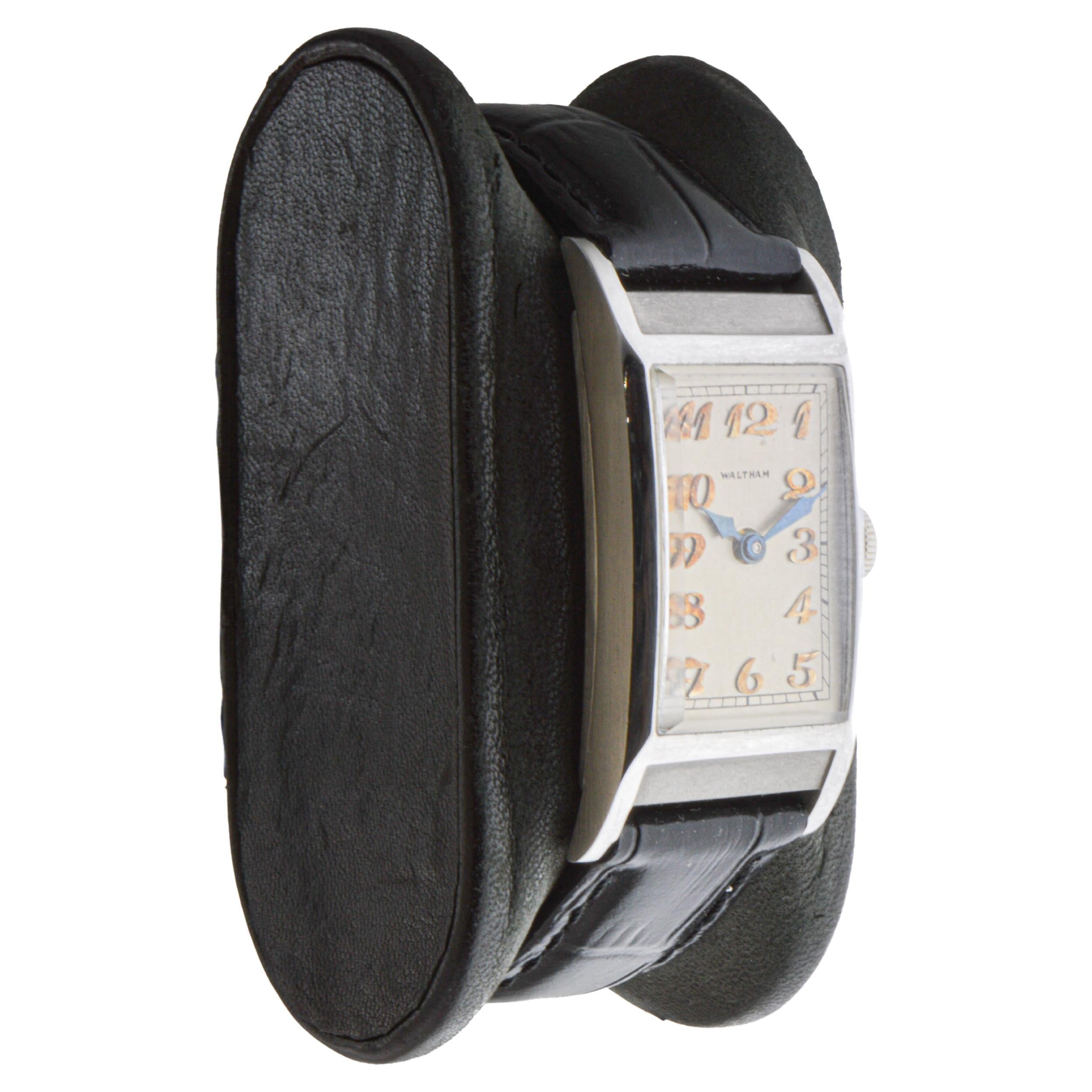 FACTORY / HOUSE: Waltham Watch Company
STYLE / REFERENCE: Art Deco / Tank Style 
METAL / MATERIAL: Platinum
CIRCA / YEAR: 1936
DIMENSIONS / SIZE: Length 20mm X Width 40mm
MOVEMENT / CALIBER: Manual Winding / 21 Jewels / Caliber 16/0
DIAL / HANDS: