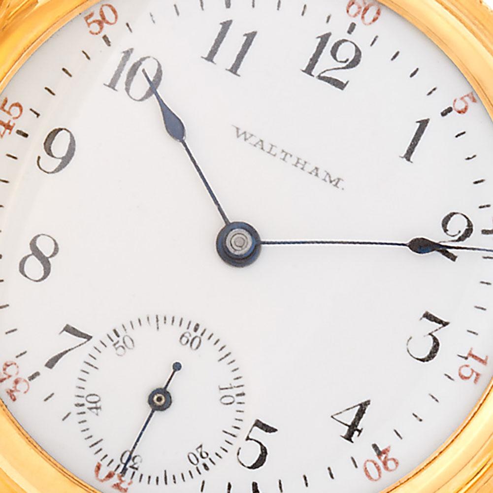 Waltham hunter case pocket watch, 15 jewels, porcelain dial and spade hands in 14k yellow gold with beautiful engraving case. Manual with sub-seconds 34mm.Circa 1900's Fine Pre-owned Waltham Watch.

Certified preowned Vintage Waltham pocket watch