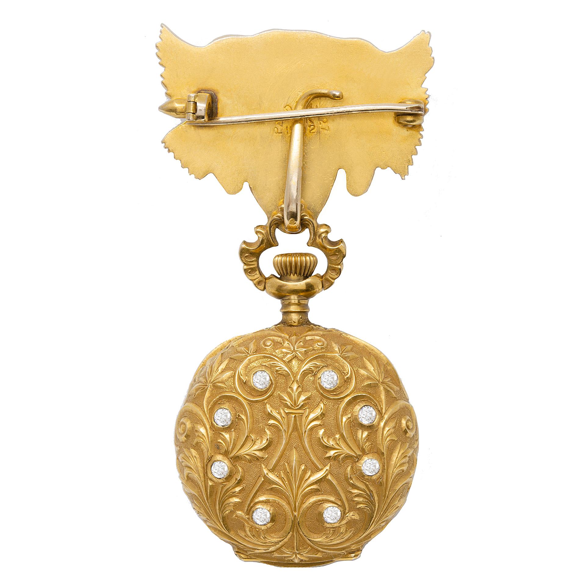 Waltham pocket watch/pendant broach with high relief hand applied diamond and gold swirls in 18k yellow gold with Lion head broach in 14k yellow gold with diamond eyes and mouth with approx 0.20 cts center diamond. An antique heirloom, over 120