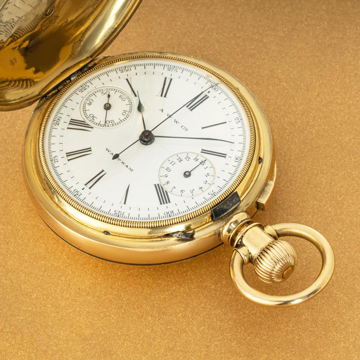 Waltham Riverside. A Rare Heavy Gold Keyless Lever Chronograph Hunter Pocket Watch C1884.

Dial: The white enamel dial with Roman numerals outer minute track, signed A.W.W. Co at twelve o'clock and Waltham at six o'clock. The unusual layout of the