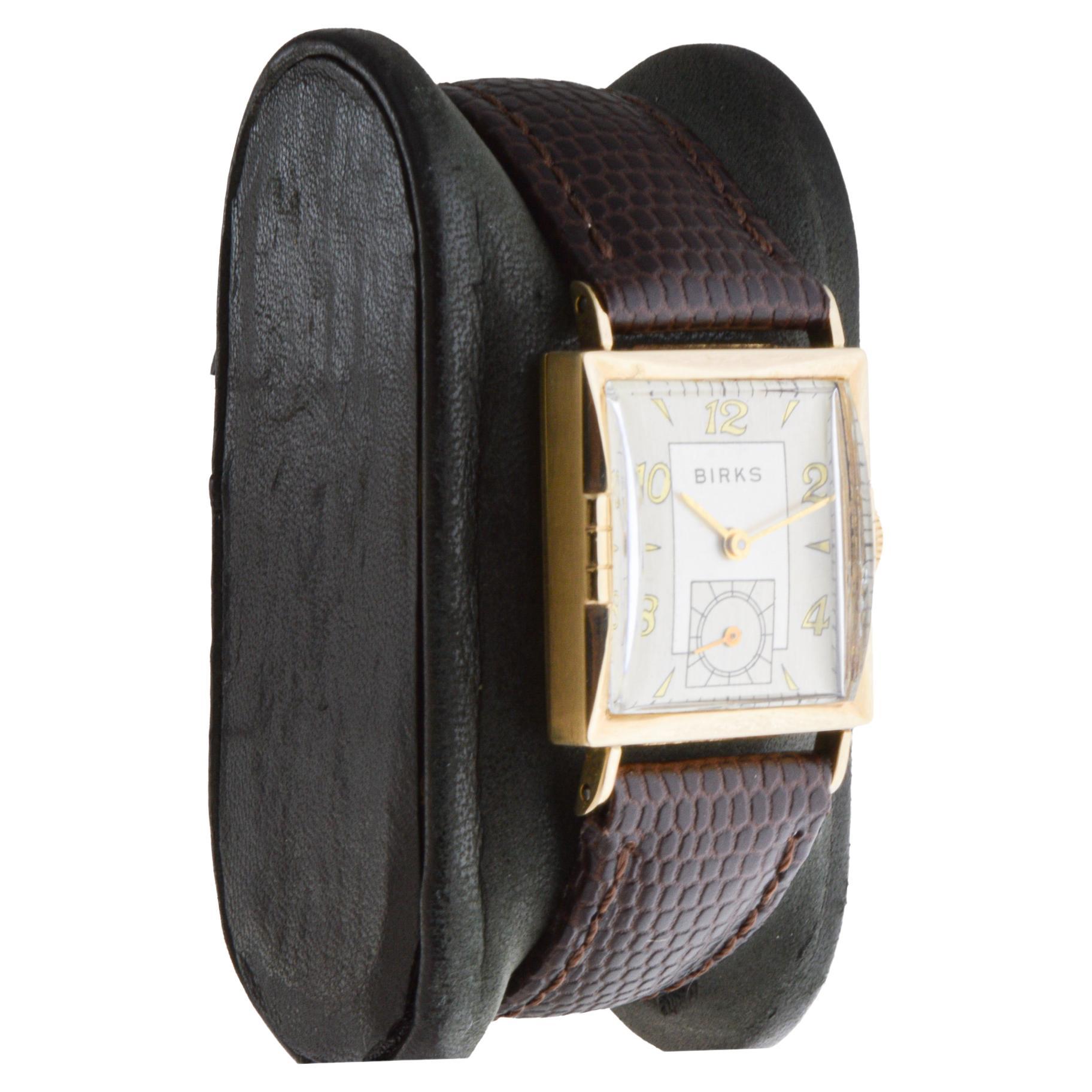 FACTORY / HOUSE: Henry Birks and Sons
STYLE / REFERENCE: Art Deco / Tank Style 
METAL / MATERIAL: 14Kt. Solid Yellow Gold
CIRCA / YEAR: 1950's
DIMENSIONS / SIZE: Length 32mm X Width 22mm
MOVEMENT / CALIBER: Manual Winding / 17 Jewels / Caliber 8 1/2