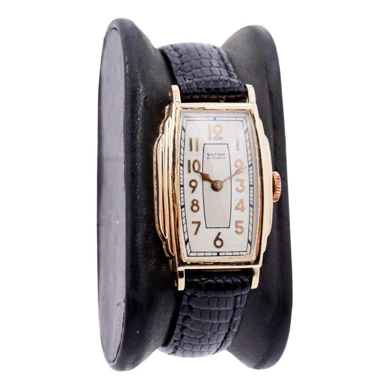 FACTORY / HOUSE: Waltham Watch Company
STYLE / REFERENCE: Art Deco / Tonneau Shaped
METAL / MATERIAL: Yellow Gold Filled
CIRCA / YEAR: 1934
DIMENSIONS / SIZE:  Length 38mm X Width 22mm
MOVEMENT / CALIBER: Manual Winding / 17 Jewels 
DIAL / HANDS: