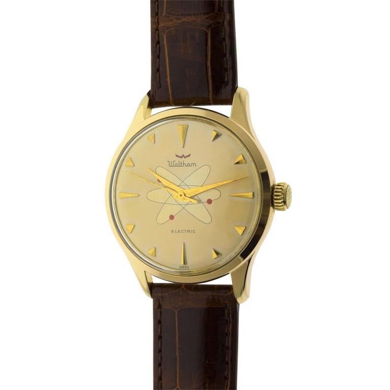 FACTORY / HOUSE: Waltham Watch Company
STYLE / REFERENCE: Round / Space Age Design
METAL / MATERIAL: Yellow Gold Filled
CIRCA: 1950's / 1960's
DIMENSIONS: 44mm X 35mm
MOVEMENT / CALIBER: Electromechanical / Battery Driven Balance Wheel / 17 Jewels