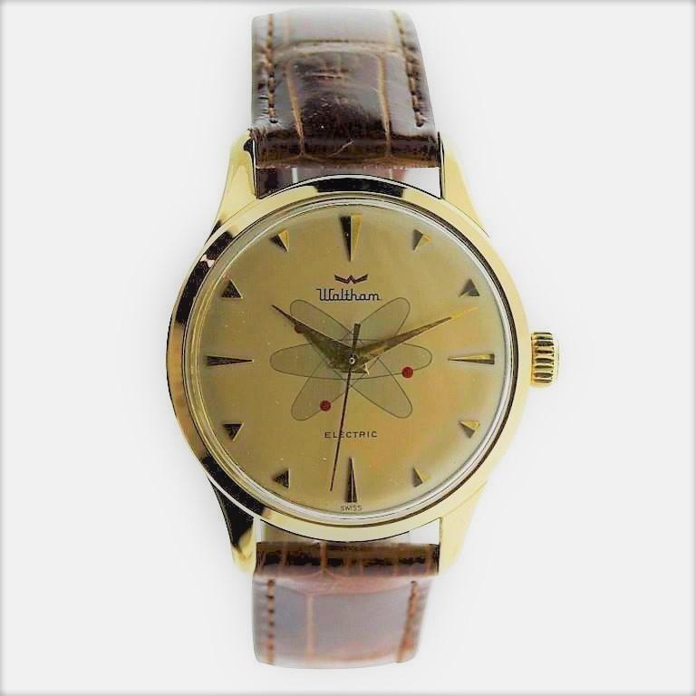 FACTORY / HOUSE: Waltham Watch Company
STYLE / REFERENCE: Round / Space Age Design
METAL / MATERIAL: Yellow Gold Filled
CIRCA: 1950's / 1960's
DIMENSIONS: Length 44mm X Diameter 35mm
MOVEMENT / CALIBER: Electromechanical / Battery Driven Balance