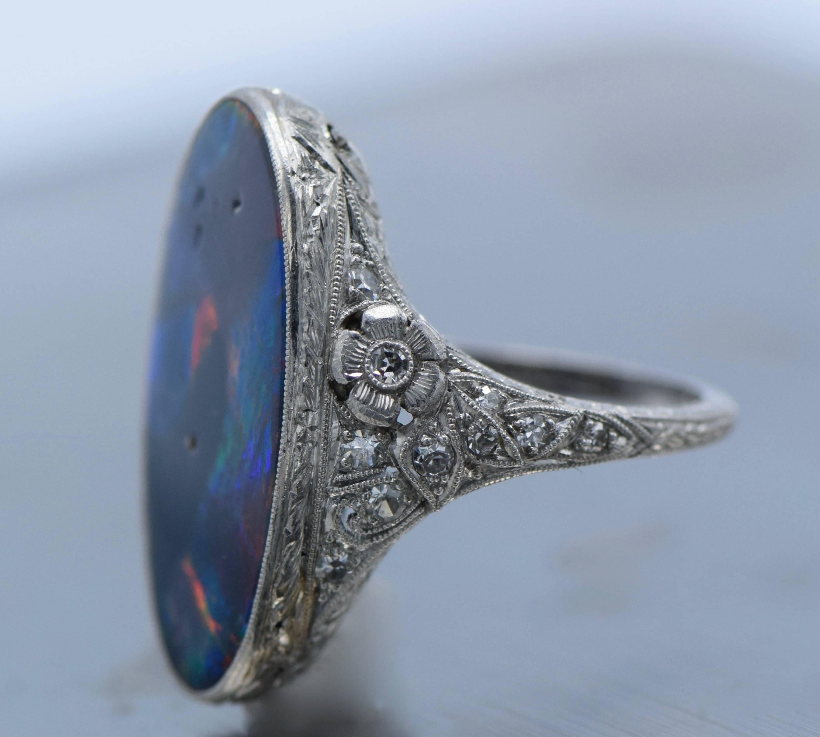 Australian Black Opal- 23-14mm 
Bezel set in etched platinum diamond deco ring 
20 round old mine diamond 